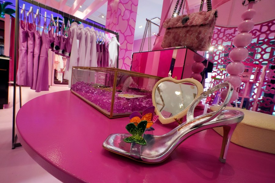 FILE - Barbie-themed merchandise is displayed in a special section at Bloomingdale's, in New York, Thursday, July 20, 2023. According to the fashion company LYST, the "Barbiecore" trend began after pictures of a pink-clad Margot Robbie surfaced online in June 2022, a year before the actor's "Barbie" movie came out and toy maker Mattel launched its own marketing blitz to promote the color. (AP Photo/Richard Drew, File)