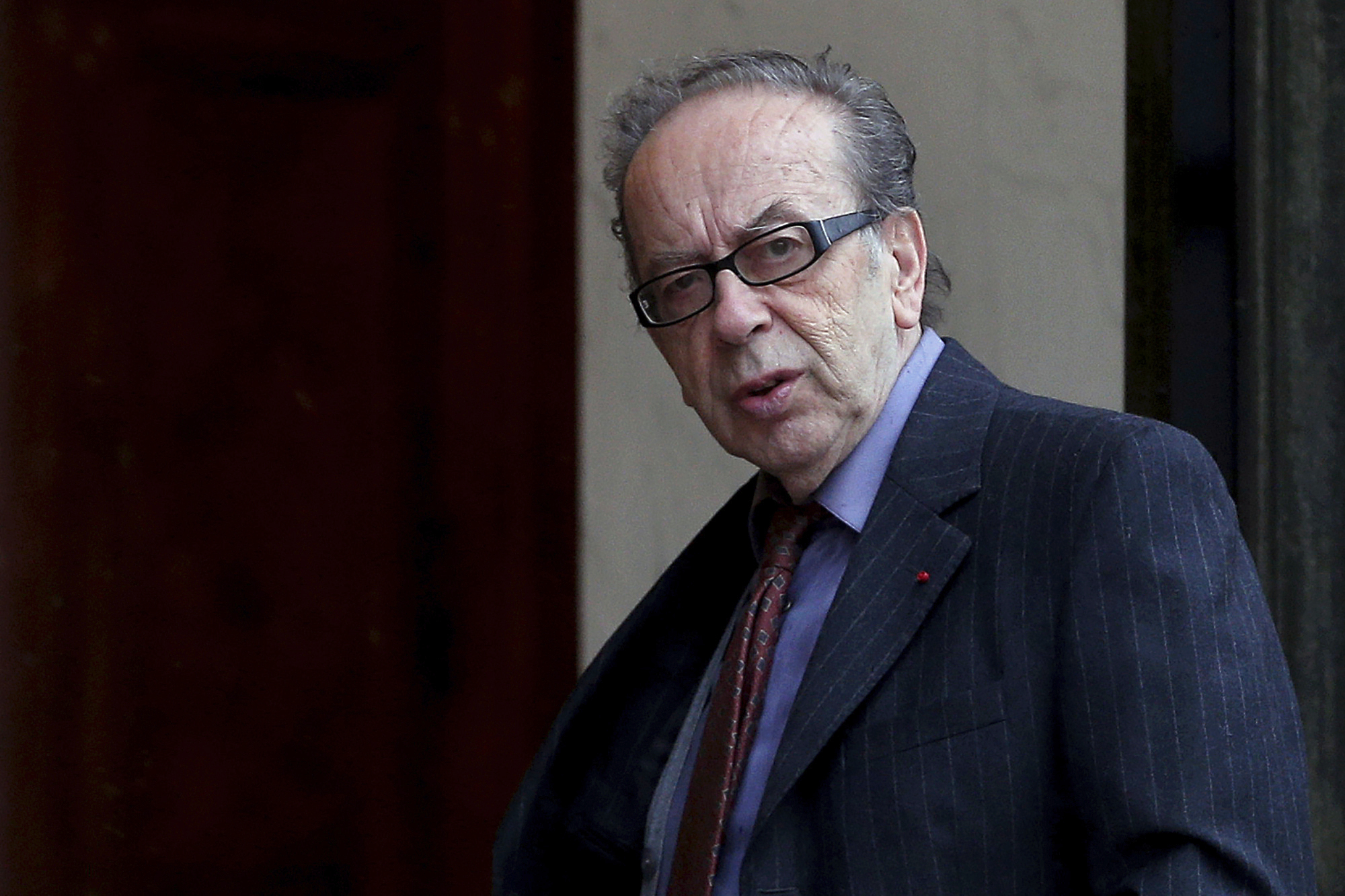 FILE - Albanian novelist Ismail Kadare arrives at the Elysee Palace to receive the France's Legion d'Honneur medal by French President Francois Hollande, in Paris, on May 30, 2016. Renowned Albanian novelist Kadare has died after being rushed to a hospital in the Albanian capital, his publishing editor said on Monday. He was 88. (AP Photo/Thibault Camus, File)