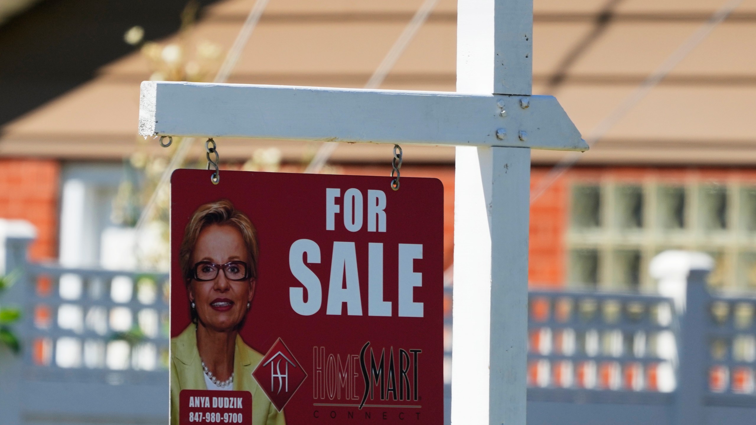 A for sale sign stands outside a residence in Niles, Ill., Monday, July 1, 2024. On Wednesday, July 3, 2024, the Labor Department reports on the number of people who applied for unemployment benefits last week. (AP Photo/Nam Y. Huh)