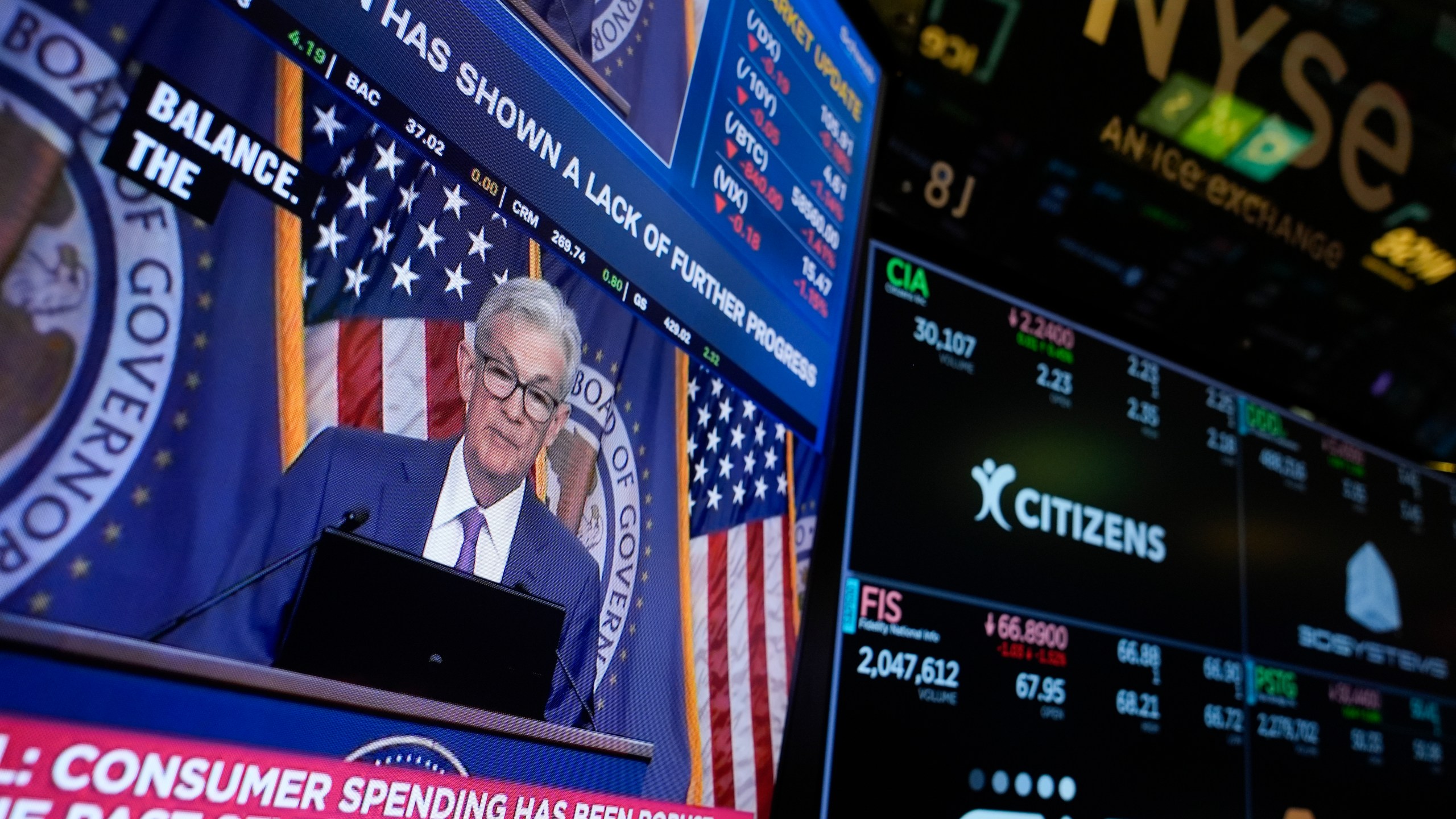 FILE - A news conference with Federal Reserve Chair Jerome Powell appears on a monitor on the floor at the New York Stock Exchange in New York, May 1, 2024. The Federal Reserve delivers the minutes from its most recent interest rate policy meeting on Wednesday, July 3, 2024. (AP Photo/Seth Wenig, File)