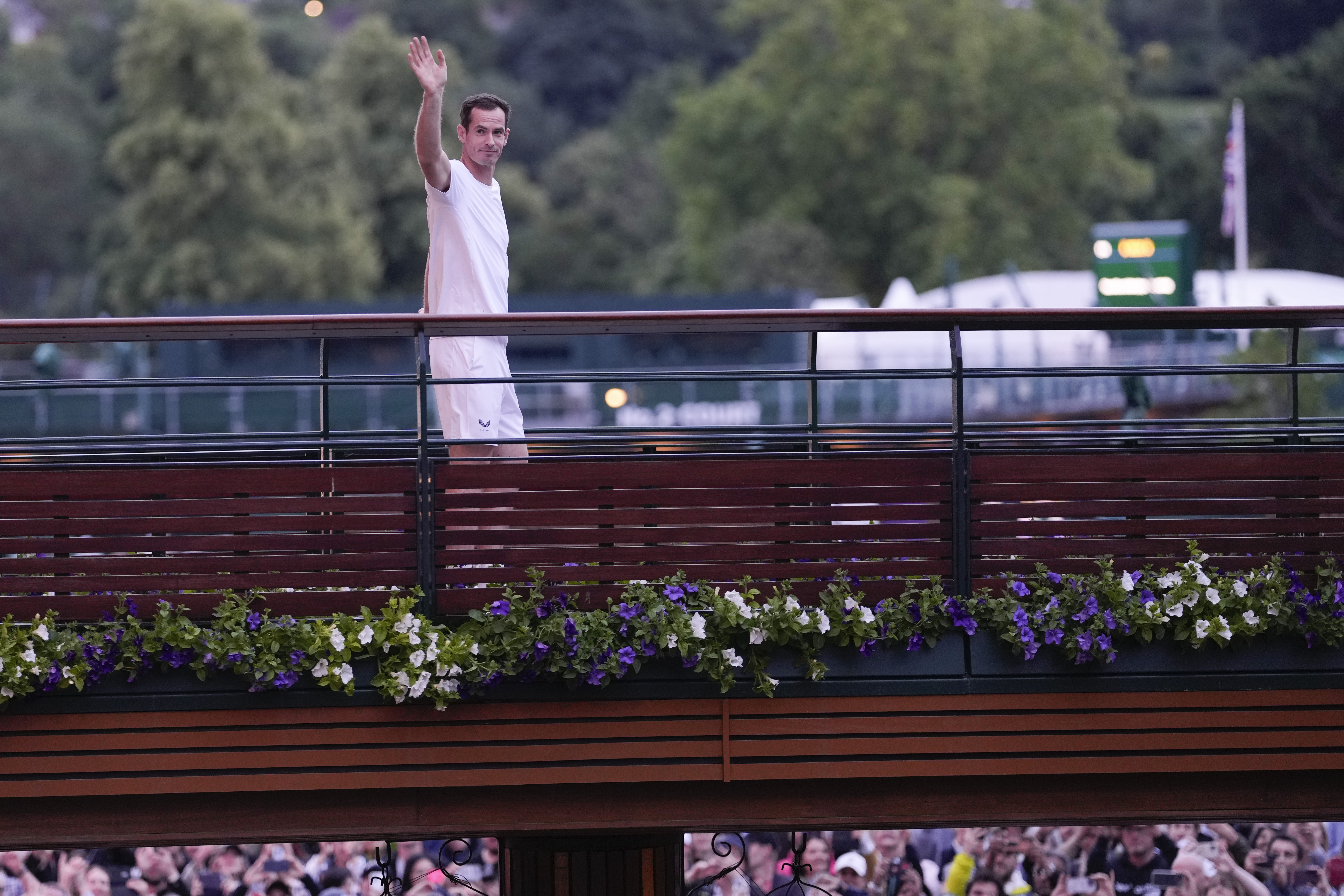 Britain's Andy Murray waves as he leaves Center Court following his first round doubles loss at the Wimbledon tennis championships in London, Thursday, July 4, 2024.(AP Photo/Alberto Pezzali)