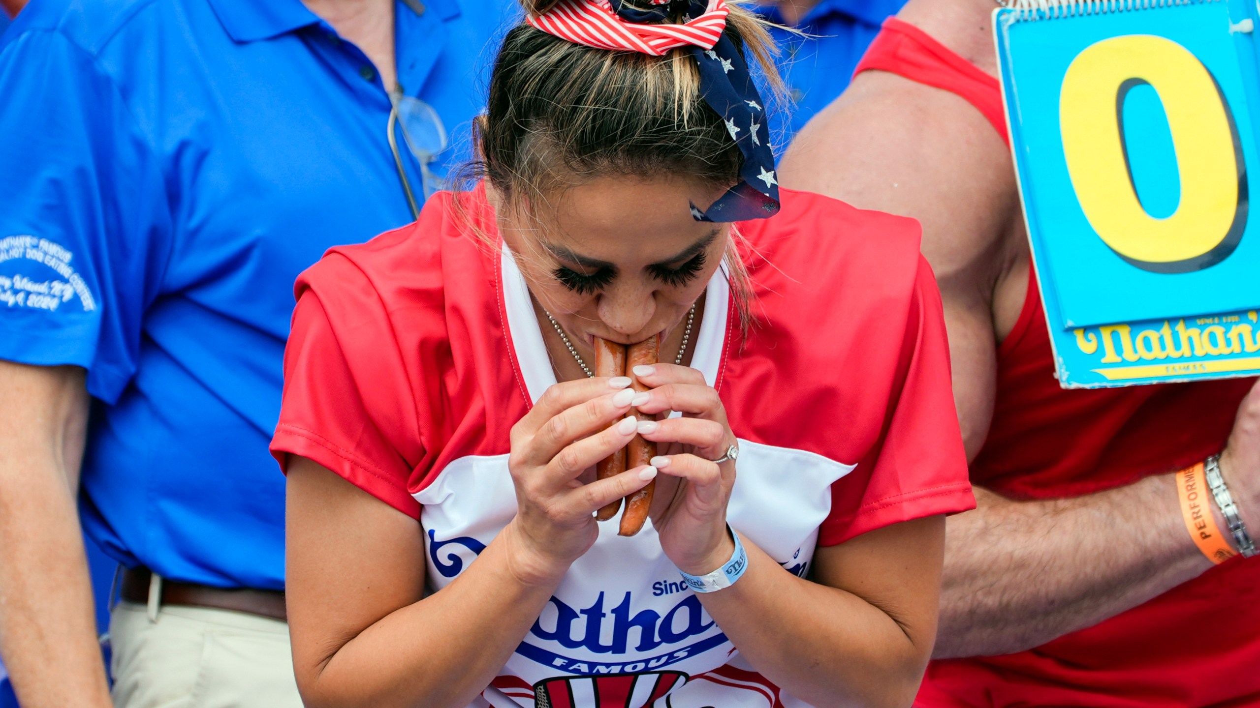 Miki Sudo competes in the Nathan's Famous Fourth of July hot dog eating contest, Thursday, July 4, 2024, at Coney Island in the Brooklyn borough of New York. Sudo ate a record 51 hot dogs. (AP Photo/Julia Nikhinson)