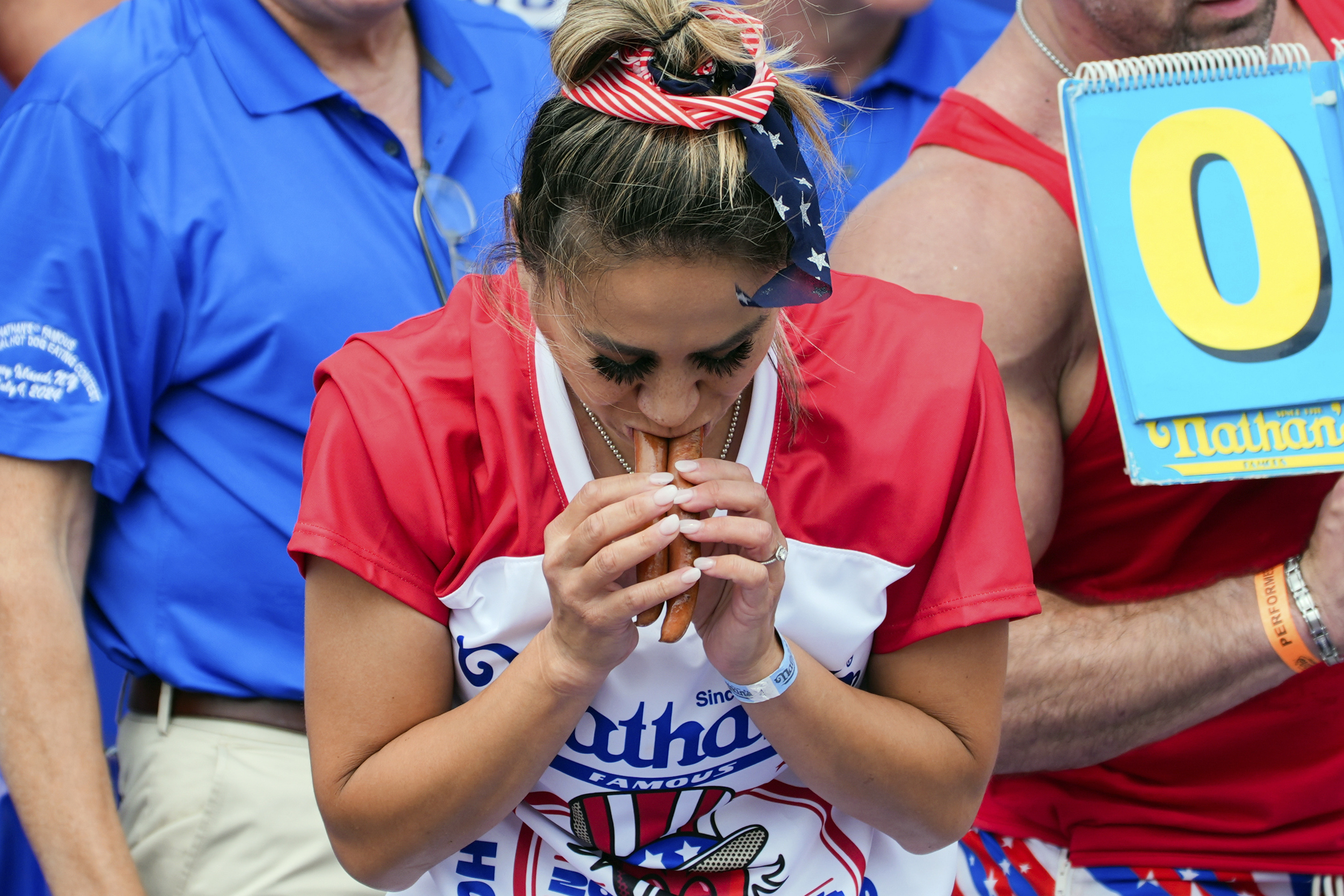 Miki Sudo competes in the Nathan's Famous Fourth of July hot dog eating contest, Thursday, July 4, 2024, at Coney Island in the Brooklyn borough of New York. Sudo ate a record 51 hot dogs. (AP Photo/Julia Nikhinson)