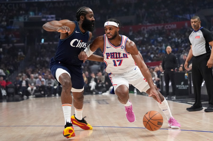 FILE - Philadelphia 76ers guard Buddy Hield (17) drives past Los Angeles Clippers guard James Harden during the first half of an NBA basketball game March 24, 2024, in Los Angeles. The 76ers continued a busy offseason by orchestrating a sign-and-trade deal that sends Hield to the Golden State Warriors for a 2031 second-round draft pick it received from the Dallas Mavericks, according to a person with knowledge of the deal. (AP Photo/Jae C. Hong, File)