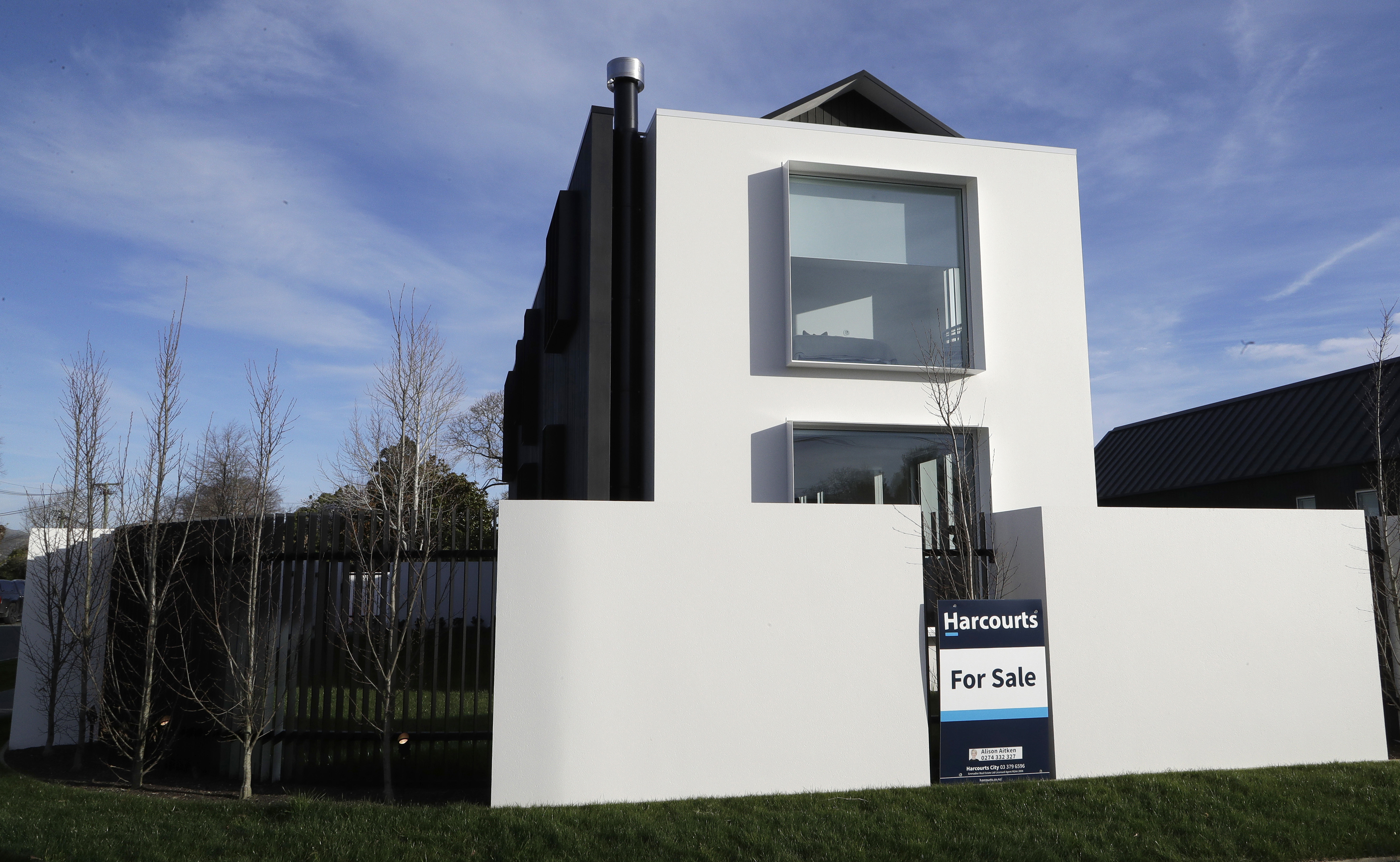 FILE - A house is for sale in Christchurch, New Zealand, Aug. 13, 2018. New Zealand's government introduced sweeping measures to free up land for new homes on Thursday, July 4, 2024, pledging to "flood the market" with opportunities to build houses, and scrap rules for minimum floor areas and balconies in apartments. (AP Photo/Mark Baker, File)