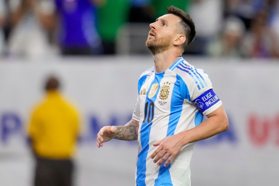 Argentina's Lionel Messi looks up after missing to score in a penalty shootout against Ecuador in a Copa America quarterfinal soccer match in Houston, Thursday, July 4, 2024. (AP Photo/Julio Cortez)