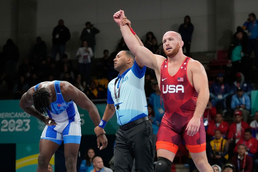 FILE - United States' Kyle Snyder, right, celebrates after winning gold against Cuba's Arturo Silot, left, during the men's 97kg wrestling freestyle final bout at the Pan American Games Santiago, Chile, Wednesday, Nov. 1, 2023. Kyle Snyder already has one of the best resumes ever for a U.S. wrestler, and he’s just now hitting his prime.(AP Photo/Matias Delacroix, File)