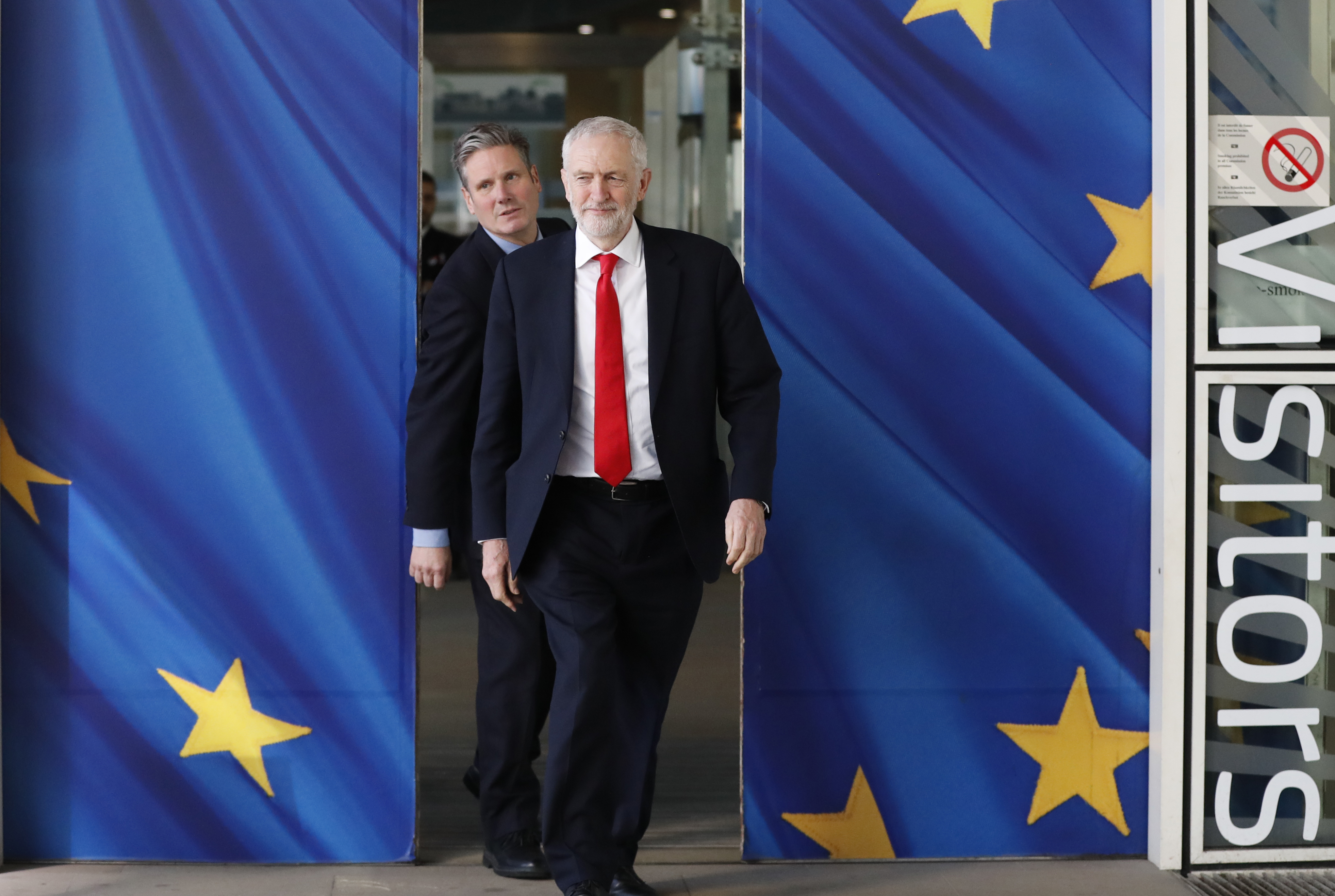 FILE - British Labour Party leader Jeremy Corbyn, right, and Keir Starmer, Labour Shadow Brexit secretary, leave EU headquarters in Brussels, on March 21, 2019. (AP Photo/Frank Augstein, File)