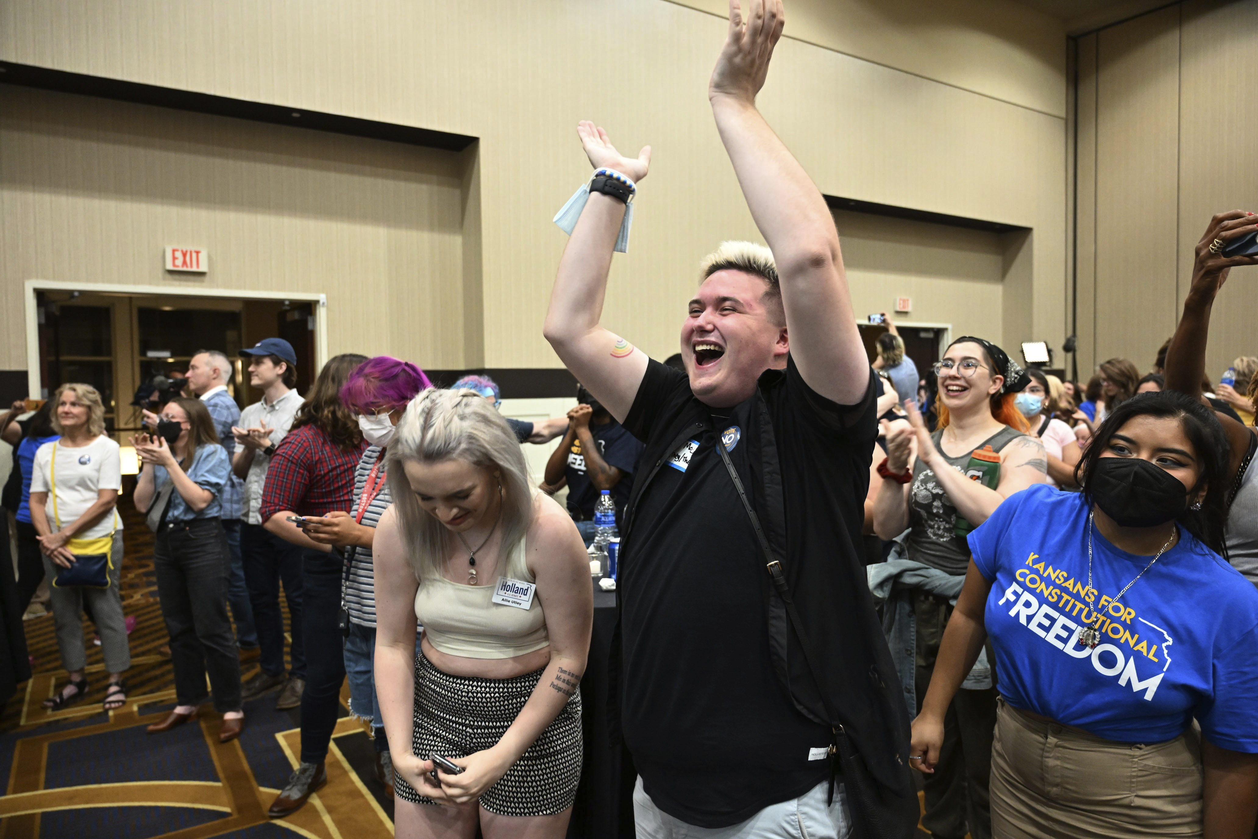 FILE - Allie Utley, left, and Jae Moyer, center, of Overland Park, react during a primary watch party Tuesday, Aug. 2, 2022, at the Overland Park, Kansas Convention Center. Kansas’ highest court on Friday, July 5, 2024, struck down state laws regulating abortion providers more strictly than other health care providers and banning a common second-trimester procedure, reaffirming its stance that the state constitution protects abortion access. (Tammy Ljungblad/The Kansas City Star via AP, File)