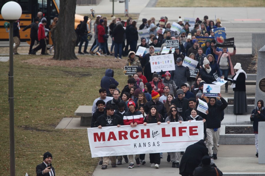 FILE - Some of the hundreds of abortion opponents and parochial school students participating in an anti-abortion rally march to the south steps of the Kansas Statehouse, Tuesday, Jan. 24, 2023, in Topeka, Kan. Kansas’ highest court on Friday, July 5, 2024, struck down state laws regulating abortion providers more strictly than other health care providers and banning a common second-trimester procedure, reaffirming its stance that the state constitution protects abortion access. (AP Photo/John Hanna, File)