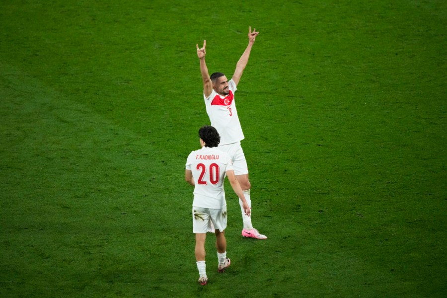 FILE - Turkey's Merih Demiral celebrates after scoring his side second goal during a round of sixteen match between Austria and Turkey at the Euro 2024 soccer tournament in Leipzig, Germany, Tuesday, July 2, 2024. UEFA has suspended Turkey player Merih Demiral for two matches for making a controversial gesture at the European Championship. (AP Photo/Ebrahim Noroozi, File)