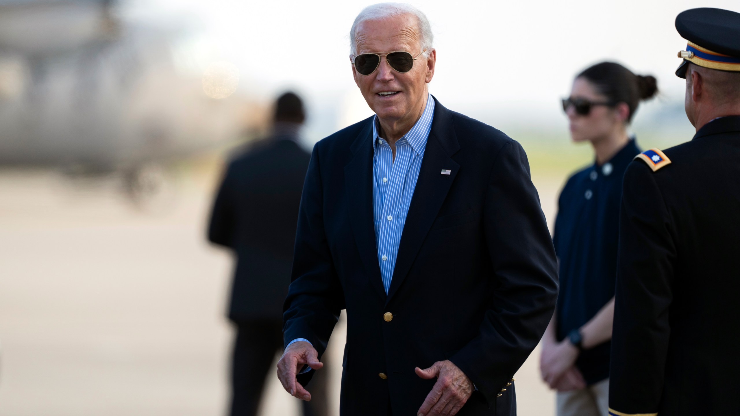 President Joe Biden responds to questions from the traveling press as he arrives at Delaware Air National Guard Base in New Castle, Del., Friday, July 5, 2024, from a campaign rally in Madison, Wis. (AP Photo/Manuel Balce Ceneta)