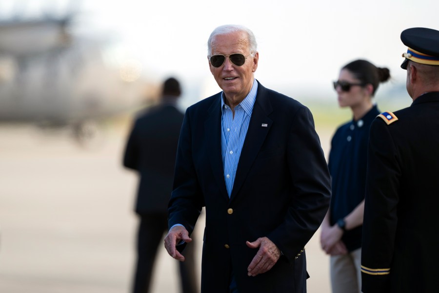 President Joe Biden responds to questions from the traveling press as he arrives at Delaware Air National Guard Base in New Castle, Del., Friday, July 5, 2024, from a campaign rally in Madison, Wis. (AP Photo/Manuel Balce Ceneta)