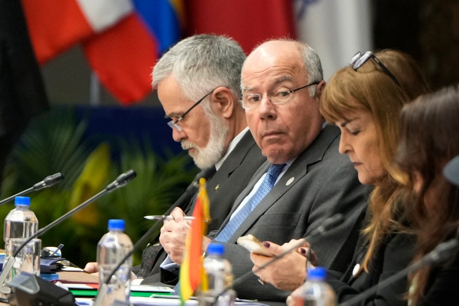 Brazil's Foreign Minister Mauro Vieira, center, attends a Mercosur summit session at the Port building in Asuncion, Paraguay, Sunday, July 7, 2024. Heads of state from South America's Mercosur trade bloc will gather in Asuncion on July 8. (AP Photo/Jorge Saenz)