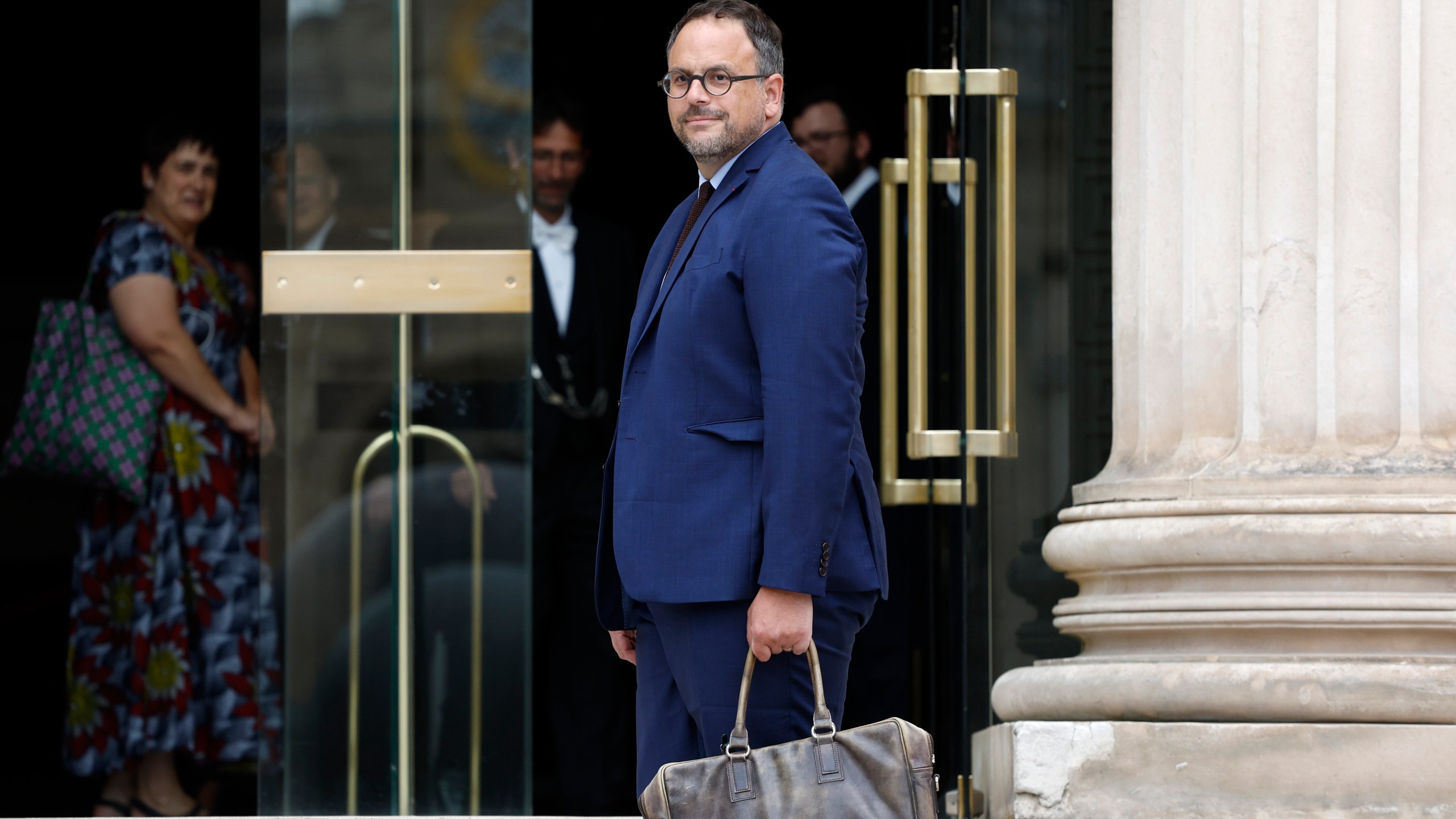 Elected parliament member Aurelien Rousseau, of the leftist coalition New Popular Front, arrives at the National Assembly, Monday, July 8, 2024 in Paris. French President Emmanuel Macron rejected the resignation of Prime Minister Gabriel Attal Monday, in the wake of a chaotic election result that left neither left, right, nor center with a majority in the National Assembly. (AP Photo/Aurelien Morissard)