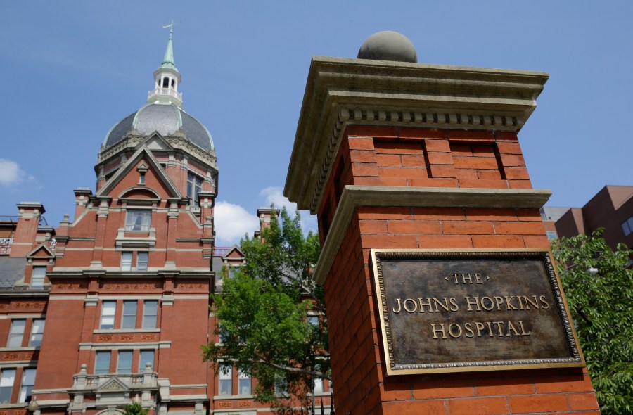 A sign stands in front of part of the Johns Hopkins Hospital complex, July 8, 2014, in Baltimore. Most medical students at Johns Hopkins University will no longer pay tuition thanks to a $1 billion gift from Bloomberg Philanthropies. Starting in the fall, the gift announced Monday, July 8, 2024 will cover full tuition for medical students from families earning less than $300,000. (AP Photo/Patrick Semansky, file)