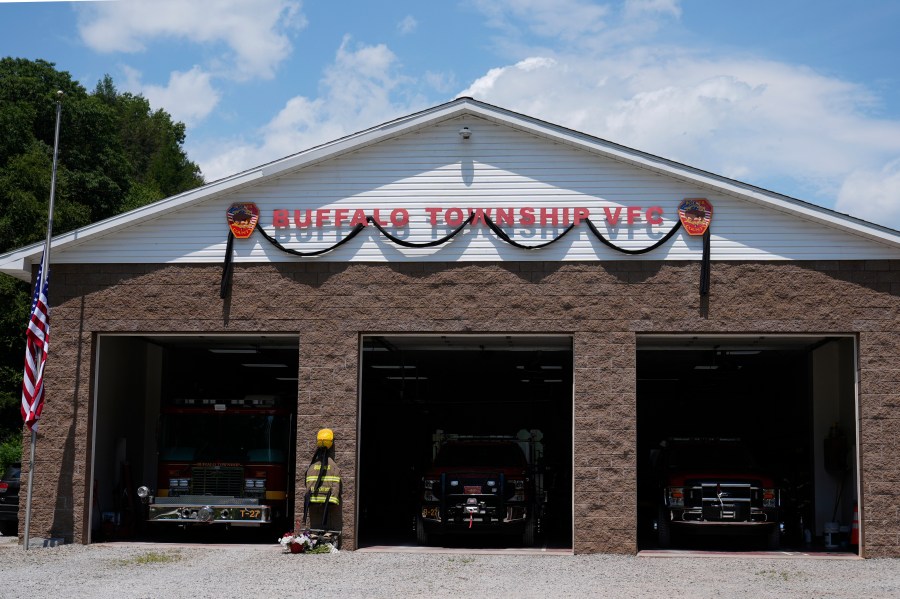 Flowers and a tribute to fallen firefighter Corey Comperatore are pictured at the Buffalo Township Volunteer Fire Company in Buffalo Township, Pa., Monday, July 15, 2024. Comperatore was shot and killed at the Trump rally in Butler, Pa., Saturday, July 13, 2024. (AP Photo/Sue Ogrocki)