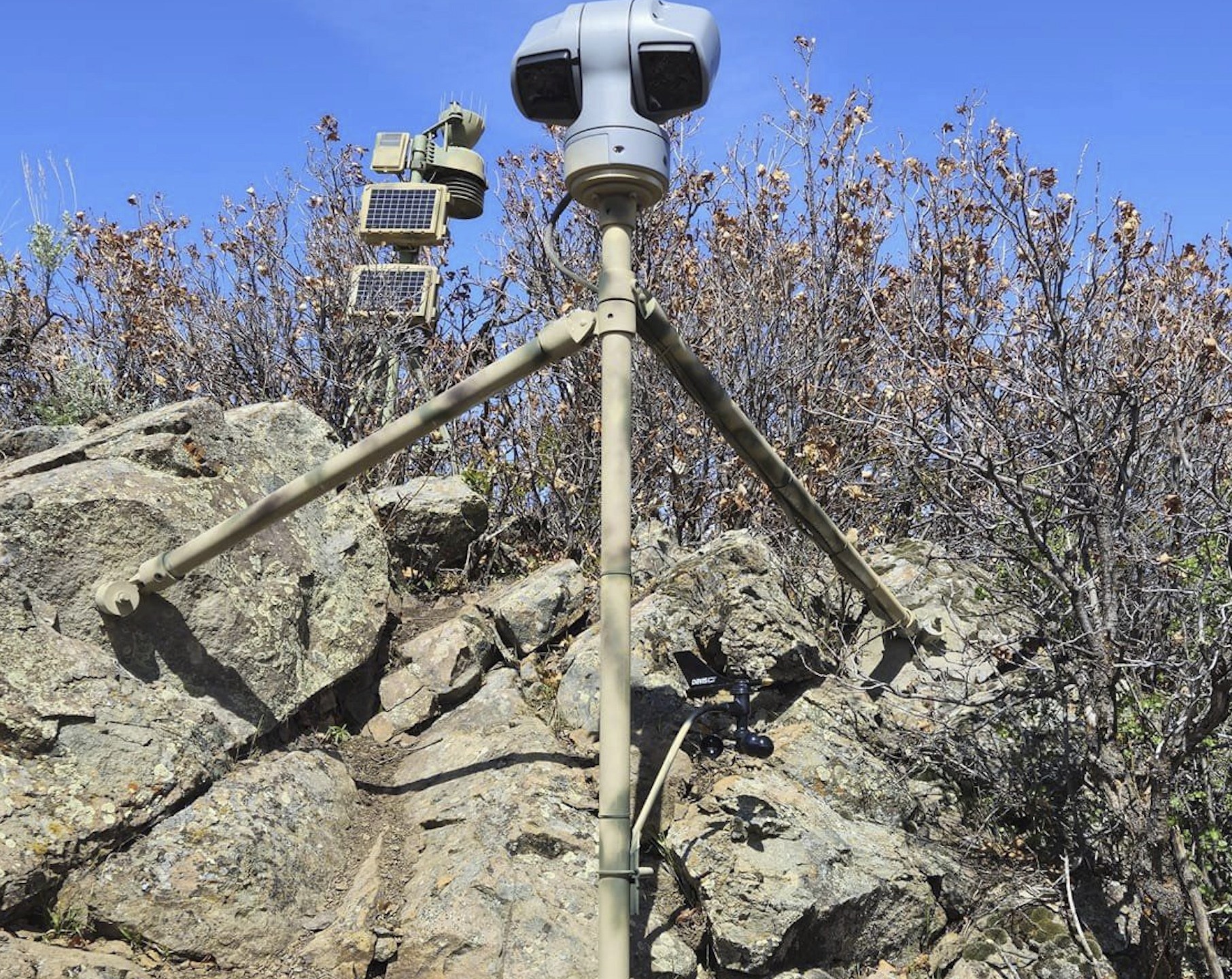 This image provided by Emily Taylor shows the weather station and camera setup, which are part of the Cal Poly research and community service initiative, Project RattleCam, in northern Colorado, in May 2024. The camera is live streaming a "mega den" of rattlesnakes. (Emily Taylor/Project RattleCam via AP)