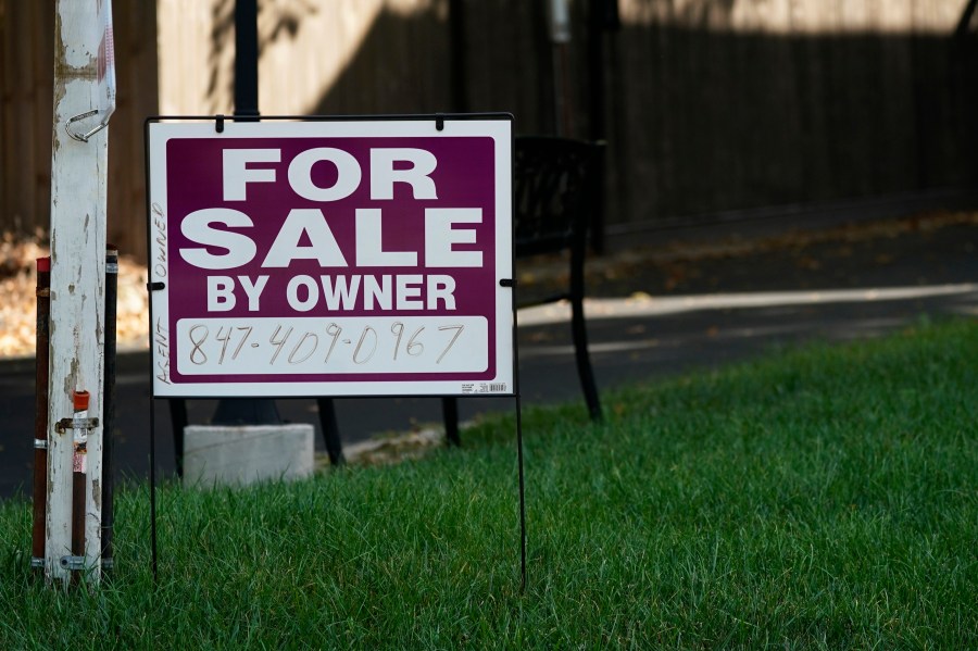 FILE - For sale by owner sign is displayed in Northbrook, Ill., Wednesday, Sept. 21, 2022. Sales of U.S. homes to foreign nationals have fallen to the lowest level in more than a decade, hampered by a strong dollar and many of the affordability hurdles that have kept the housing market in a deep sales slump for over two years. (AP Photo/Nam Y. Huh)