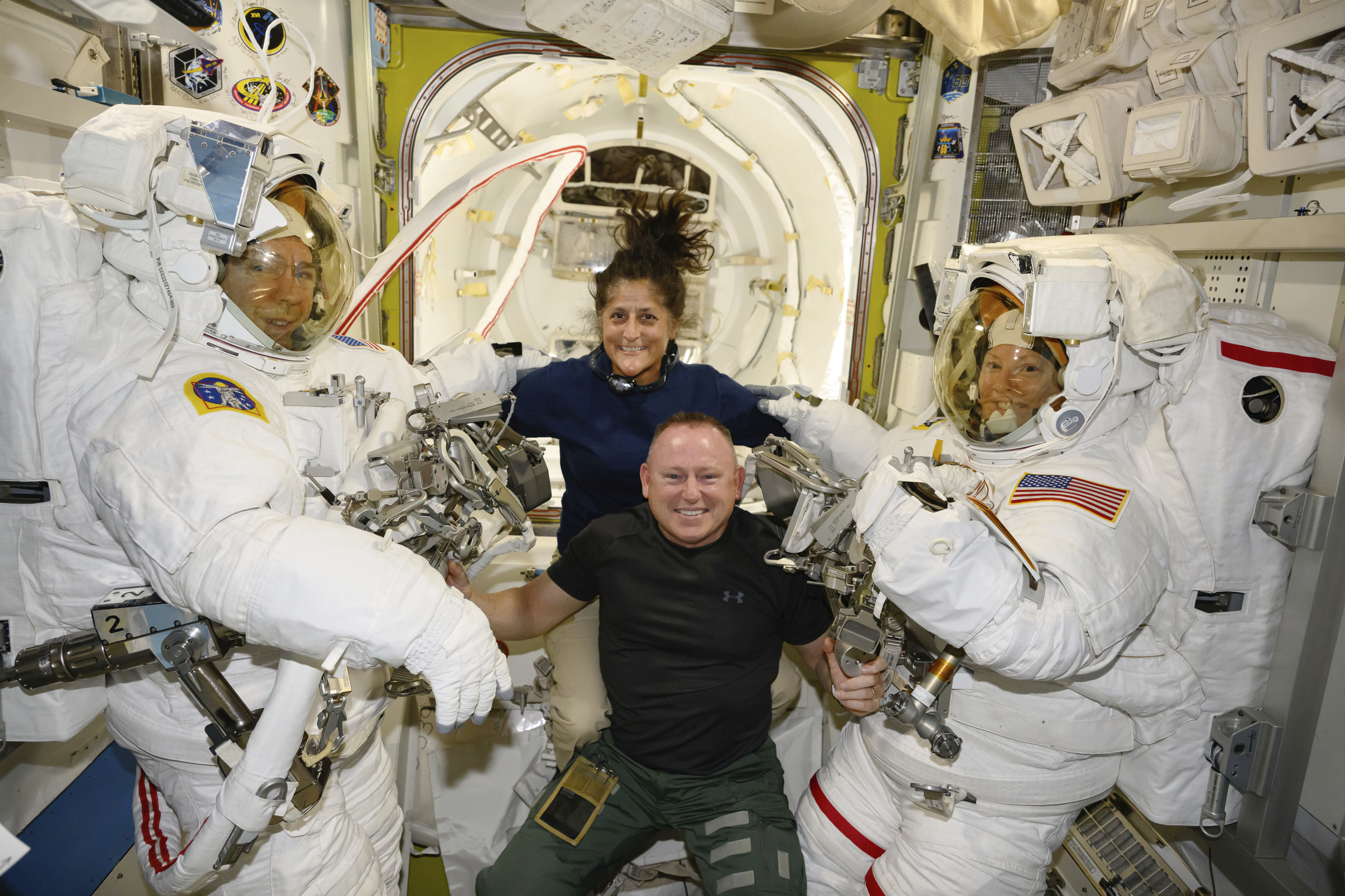 FILE - In this photo provided by NASA, Boeing Crew Flight Test astronauts Suni Williams and Butch Wilmore, center, pose with Expedition 71 Flight Engineers Mike Barratt, left, and Tracy Dyson, aboard the International Space Station's Quest airlock on June 24, 2024. Officials said Thursday, July 18, there’s still no return date for Williams and Wilmore, who have been at the International Space Station since June 6. (NASA via AP, File)