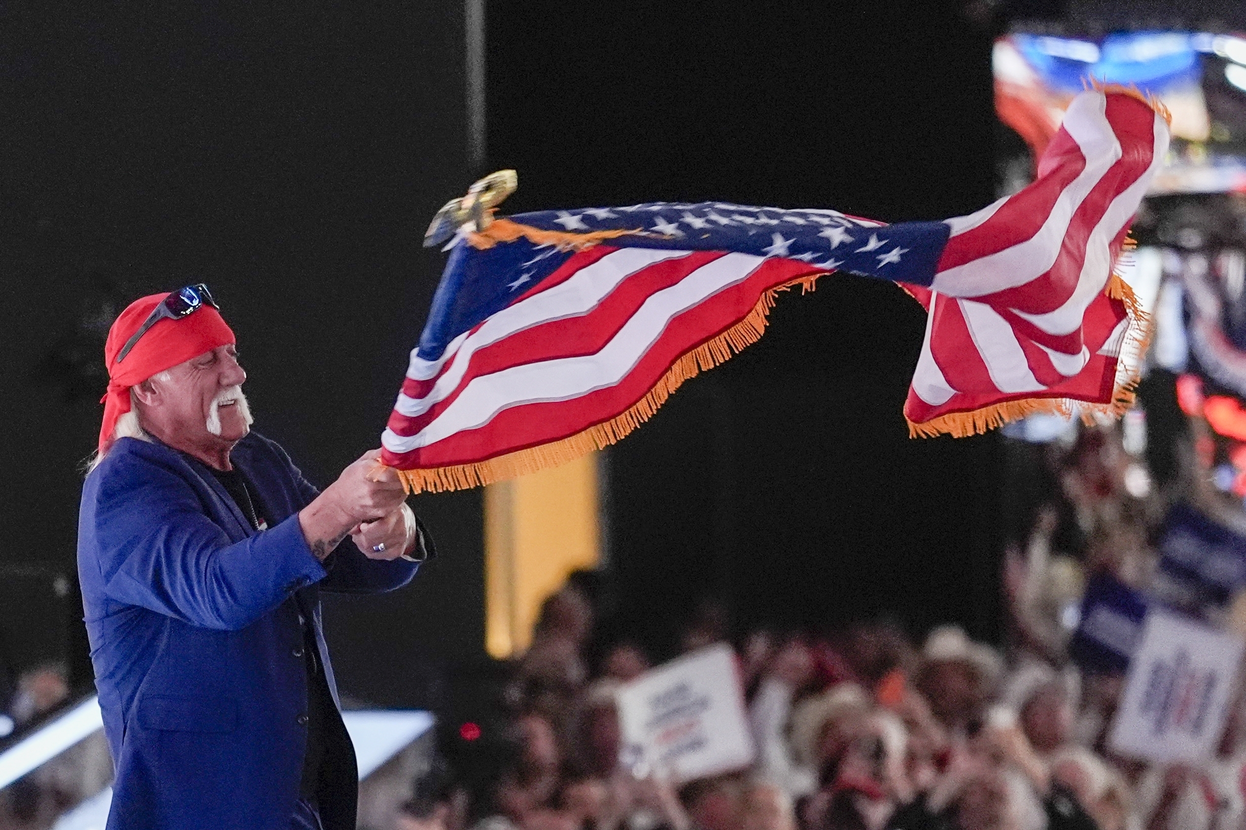 Hulk Hogan waves a flag during the Republican National Convention Thursday, July 18, 2024, in Milwaukee. (AP Photo/Matt Rourke)