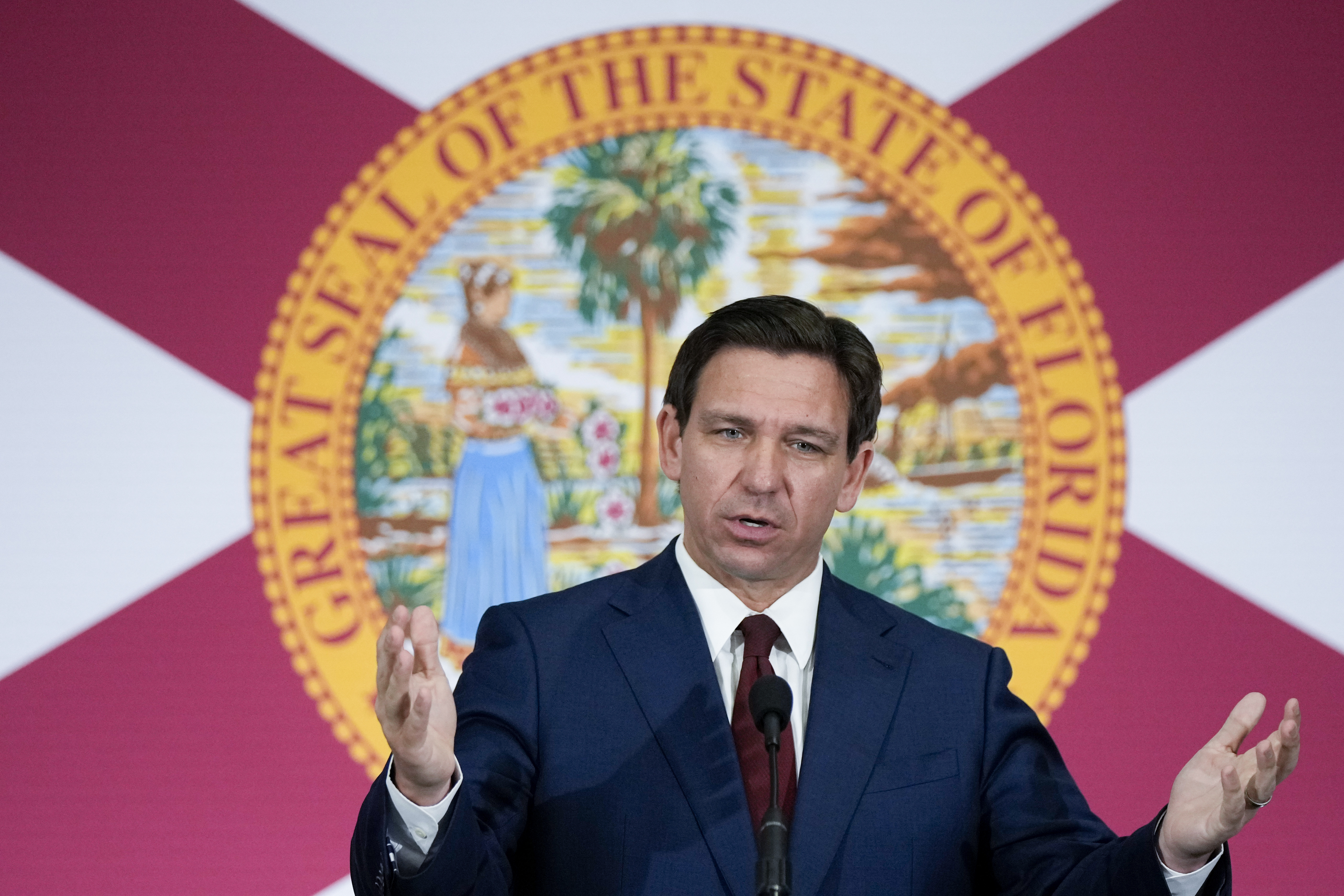 FILE - Florida Gov. Ron DeSantis speaks during a news conference in Miami, on May 9, 2023. The Treasury Department is warning that state laws that restrict banks from considering environmental, social and governance factors could harm efforts to address money laundering and terrorism financing. The Associated Press obtained a copy of a letter sent Thursday to lawmakers. The letter single out a law signed by Florida Gov. Ron DeSantis in May that says it would be an “unsafe and unsound practice” for banks to consider non-financial factors when doing business. (AP Photo/Rebecca Blackwell, File)