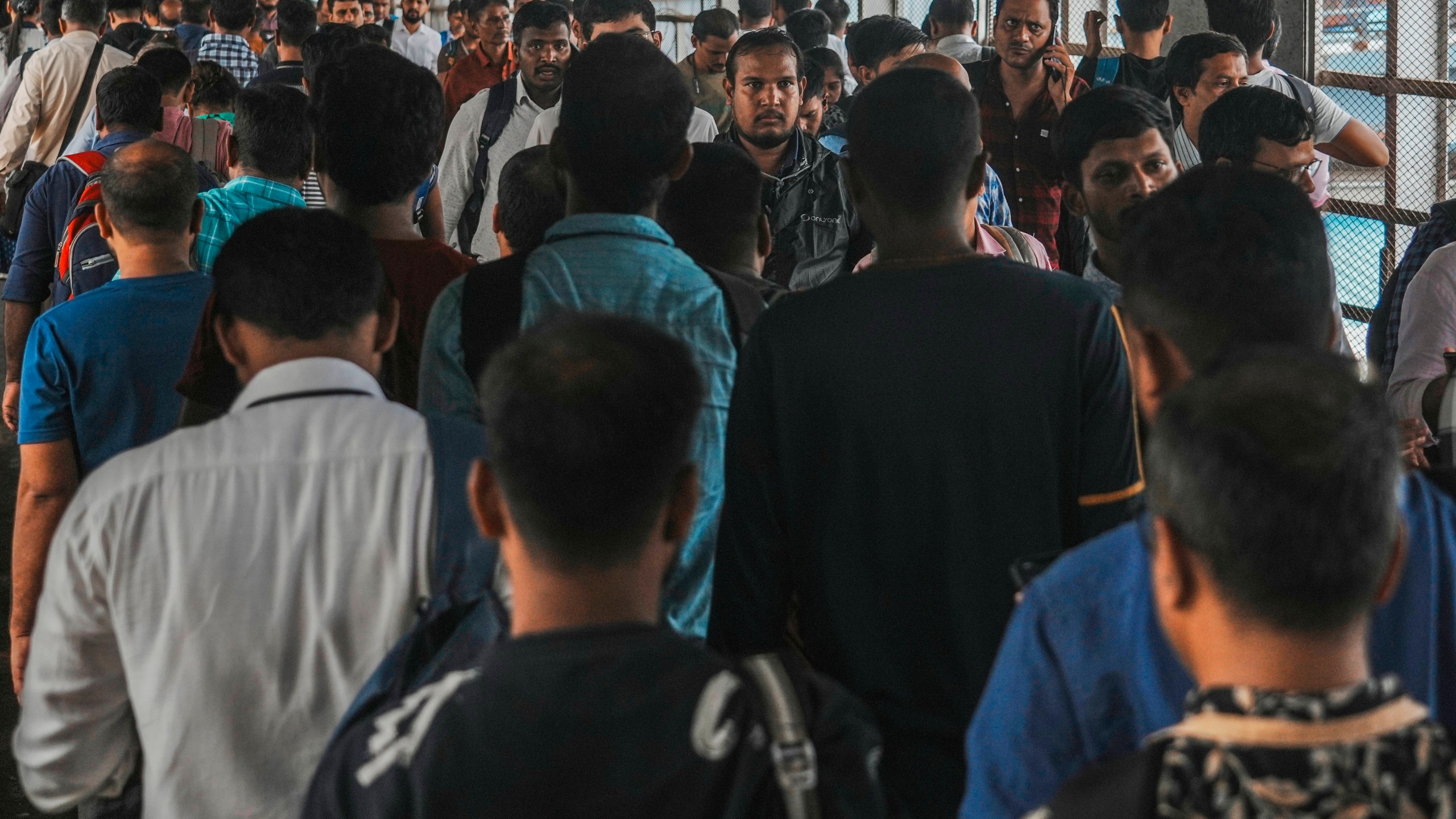 Indian commuters leave the Dadar train terminus in Mumbai, India, Tuesday, July 23, 2024. India’s finance minister Nirmala Sitharaman on Tuesday unveiled the first full annual budget of the newly elected government following the national election. (AP Photo/Rafiq Maqbool)