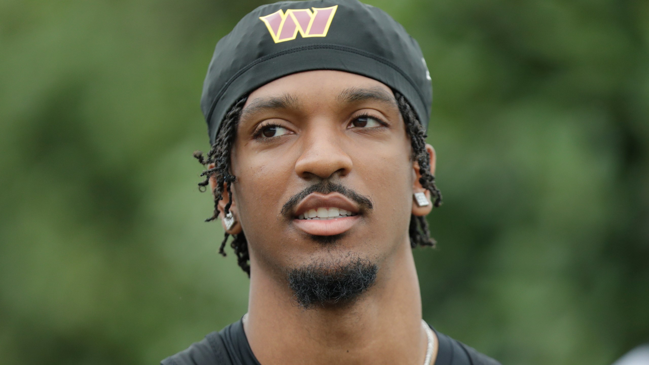 Washington Commanders quarterback Jayden Daniels is seen during an NFL football practice at the team's training facility in Ashburn, Va., Wednesday, July 24, 2023. (AP Photo/Luis M. Alvarez)