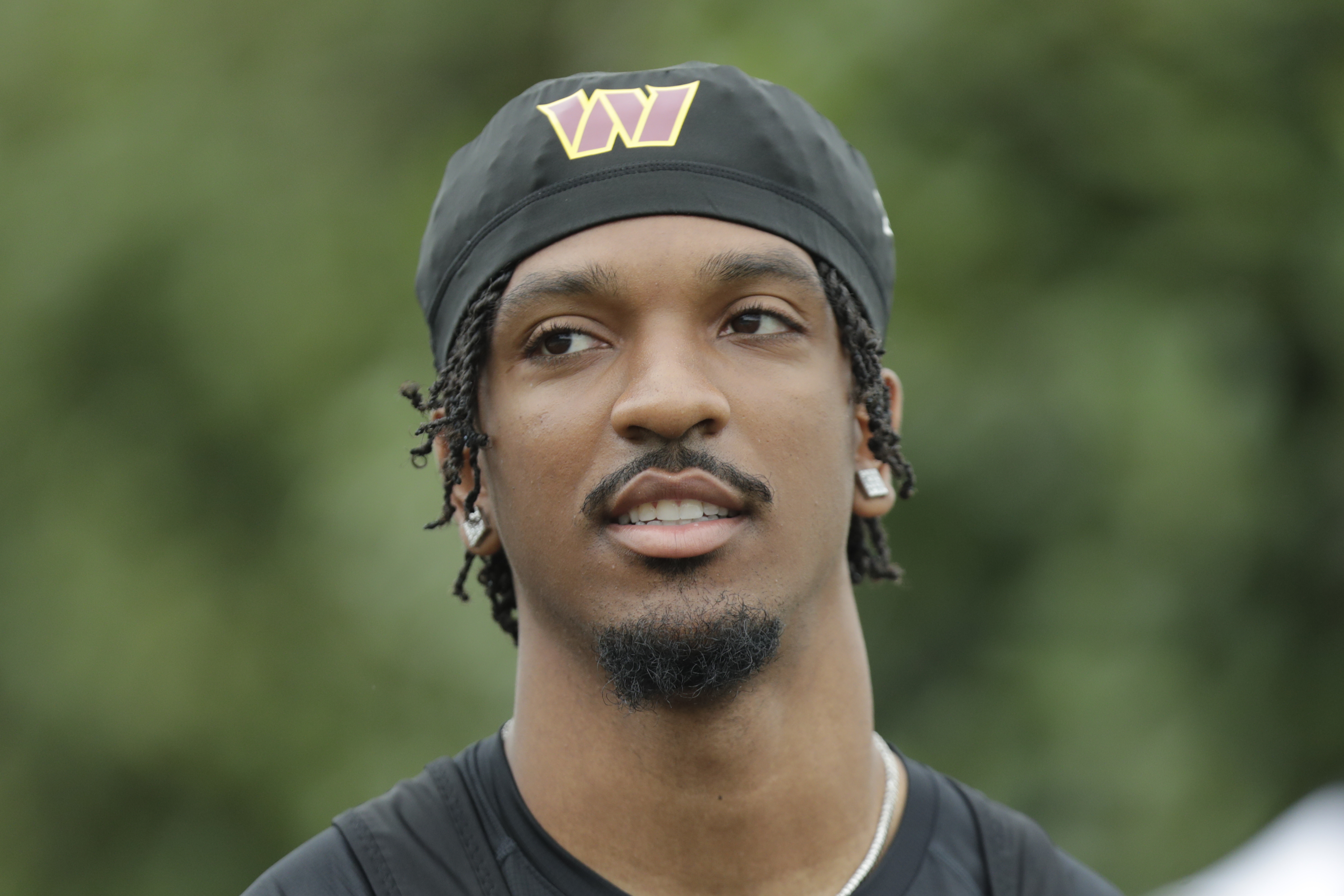 Washington Commanders quarterback Jayden Daniels is seen during an NFL football practice at the team's training facility in Ashburn, Va., Wednesday, July 24, 2023. (AP Photo/Luis M. Alvarez)