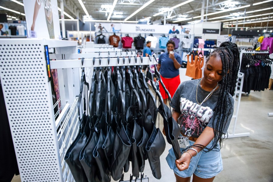 Za'kyra Davis looks at items from Walmart's No Boundaries brand at a Walmart Superstore in Secaucus, New Jersey, Thursday, July 11, 2024. Walmart relaunched No Boundaries, its 30-year-old brand for teenagers and young adults, earlier this month with a new 130-piece fall collection. (AP Photo/Eduardo Munoz Alvarez)