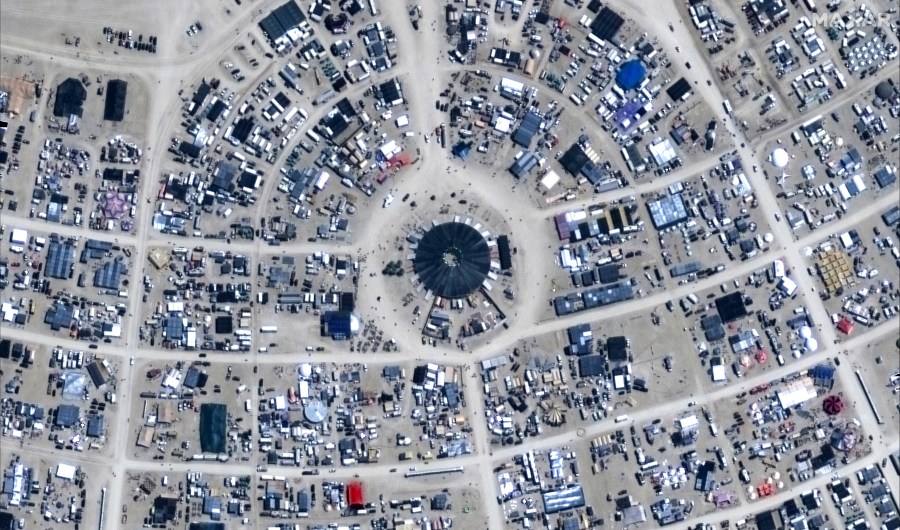 This image released by Maxar Technologies shows an overview of the center camp of the Burning Man 2024 festival, Sunday, Aug. 25, 2024, in Black Rock City, Nev. (Satellite image ©2024 Maxar Technologies via AP)