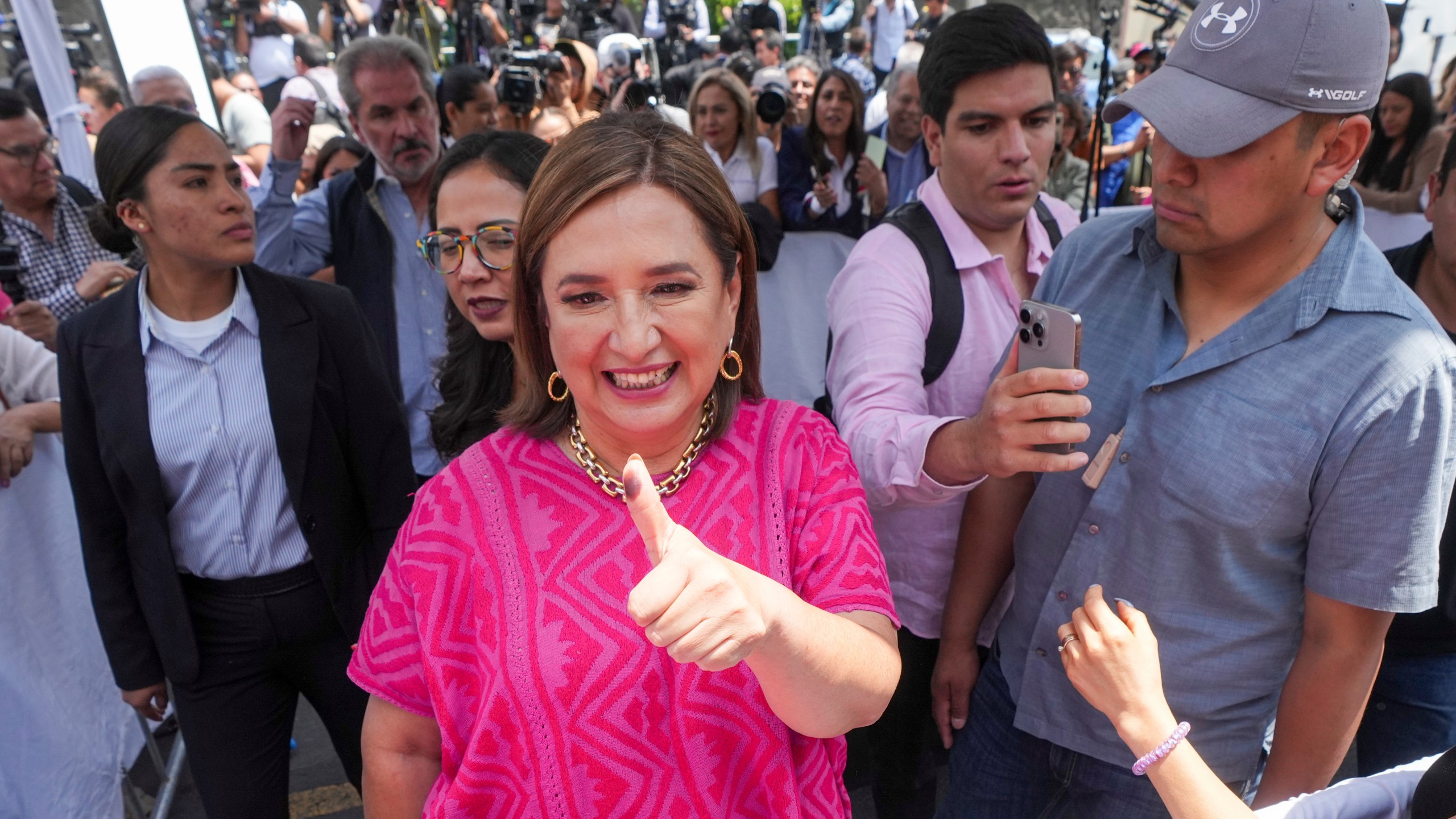 FILE - Opposition presidential candidate Xóchitl Gálvez shows her inked-stained thumb as she leaves a polling station after voting in the general election, in Mexico City, Sunday, June 2, 2024. (AP Photo/Fernando Llano, File)