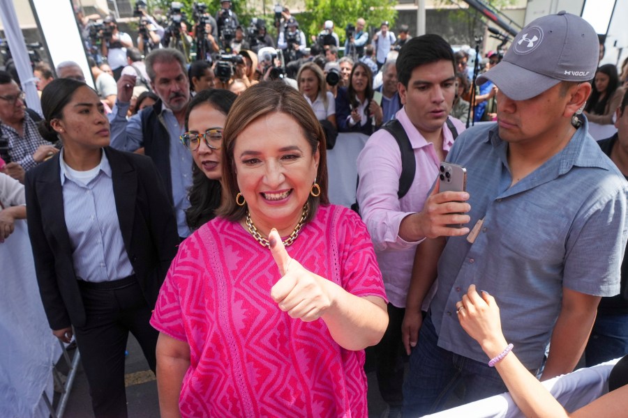 FILE - Opposition presidential candidate Xóchitl Gálvez shows her inked-stained thumb as she leaves a polling station after voting in the general election, in Mexico City, Sunday, June 2, 2024. (AP Photo/Fernando Llano, File)