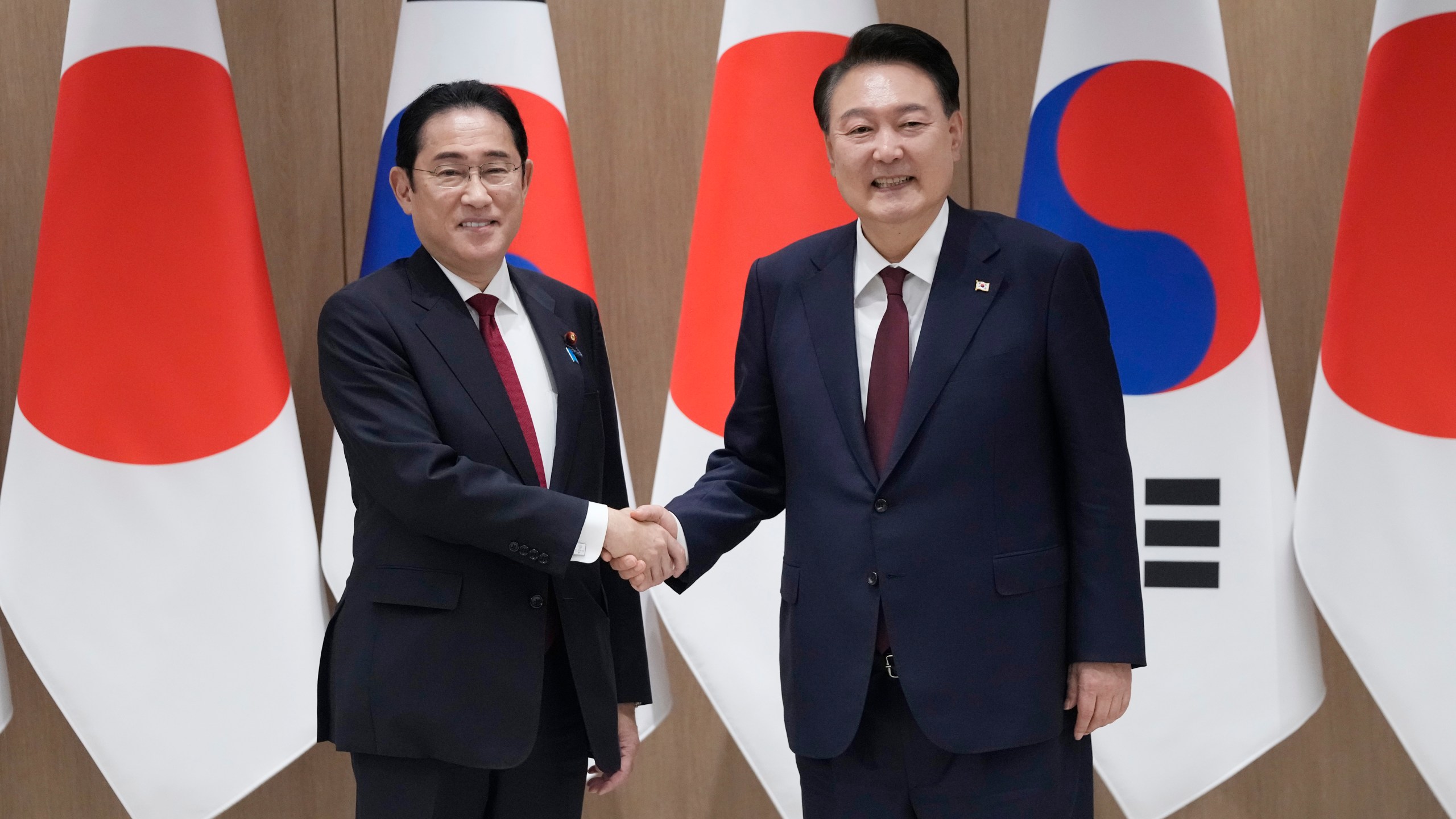 FILE - South Korean President Yoon Suk Yeol, right, shakes hands with Japanese Prime Minister Fumio Kishida during a meeting at the Presidential Office in Seoul, South Korea, on May 26, 2024. (AP Photo/Ahn Young-joon, Pool, File)