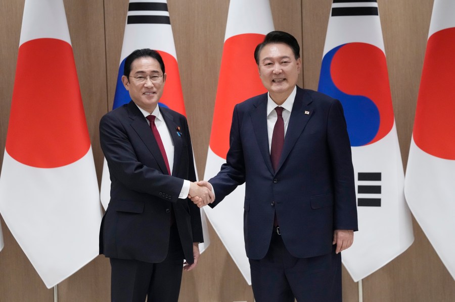 FILE - South Korean President Yoon Suk Yeol, right, shakes hands with Japanese Prime Minister Fumio Kishida during a meeting at the Presidential Office in Seoul, South Korea, on May 26, 2024. (AP Photo/Ahn Young-joon, Pool, File)