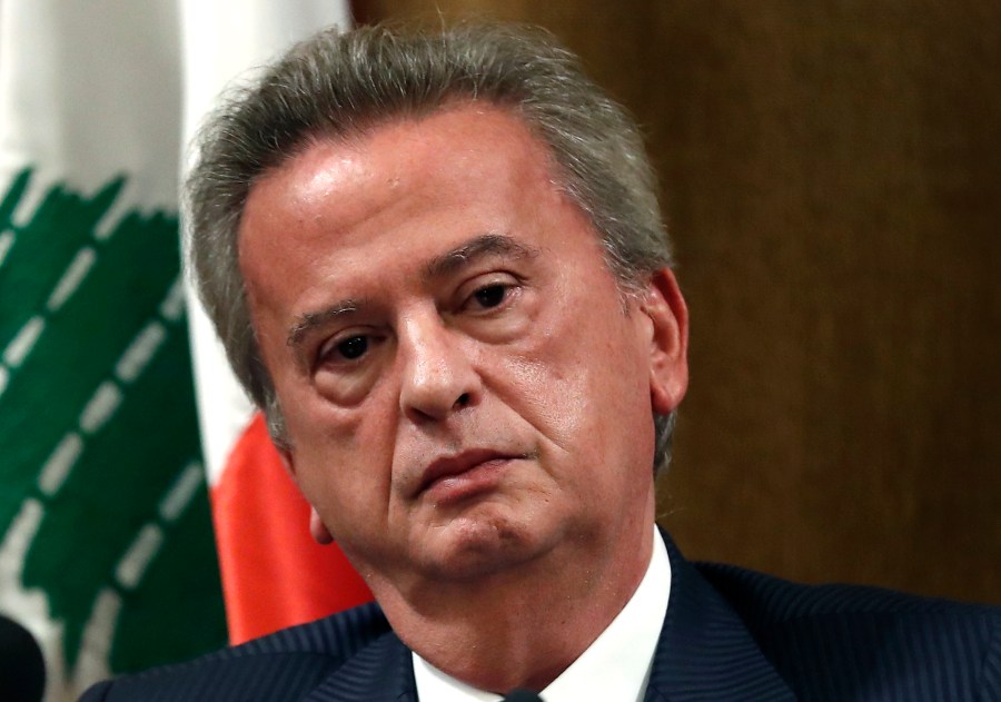 FILE - Riad Salameh the governor of Lebanon's Central Bank, listens to a journalist's question during a press conference, in Beirut, on Nov. 11, 2019. (AP Photo/Hussein Malla, File)