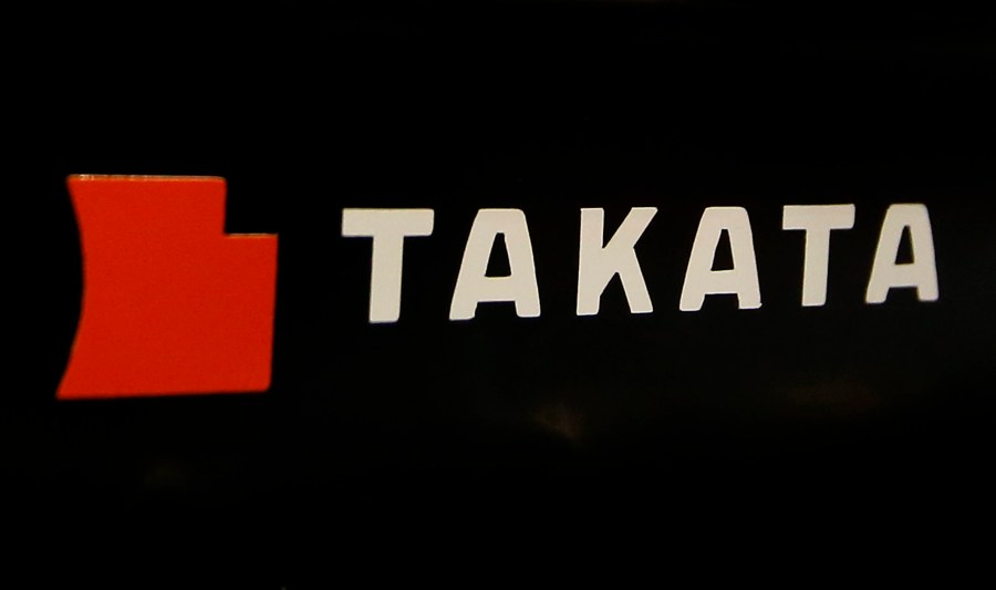 FILE - The logo of Takata Corp. is displayed at an auto supply shop in Tokyo, July 6, 2016. (AP Photo/Shizuo Kambayashi, File)