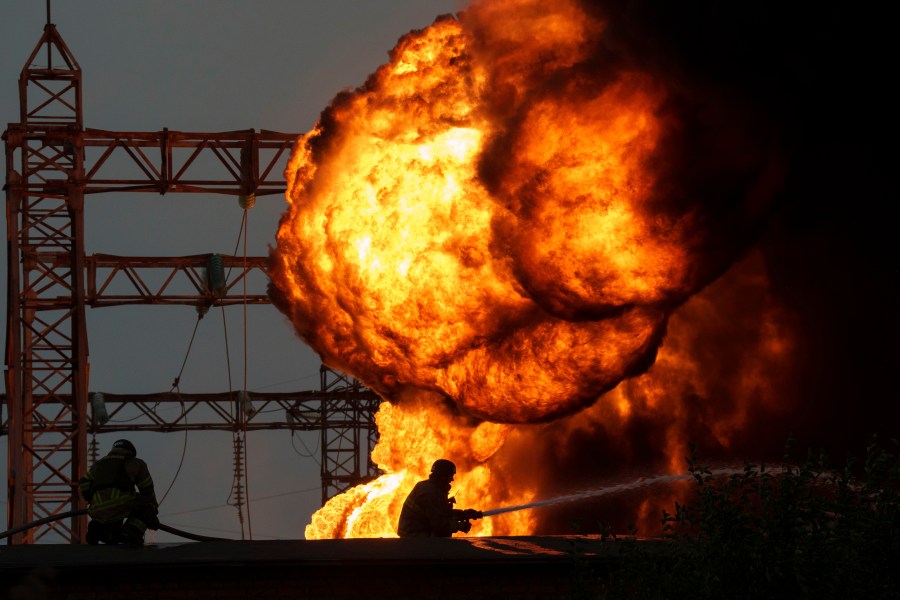 Rescue workers extinguish a fire of a burning electrical substation hit by a Russian bombing in Dnipropetrovsk region, Ukraine, Monday, Sept. 2, 2024. (AP Photo/Evgeniy Maloletka)