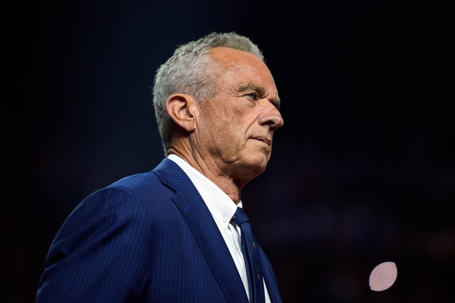 FILE - Independent presidential candidate Robert F. Kennedy Jr. listens before endorsing Republican presidential nominee former President Donald Trump at a campaign rally at the Desert Diamond Arena, Friday, Aug. 23, 2024, in Glendale, Ariz. (AP Photo/Evan Vucci, File)