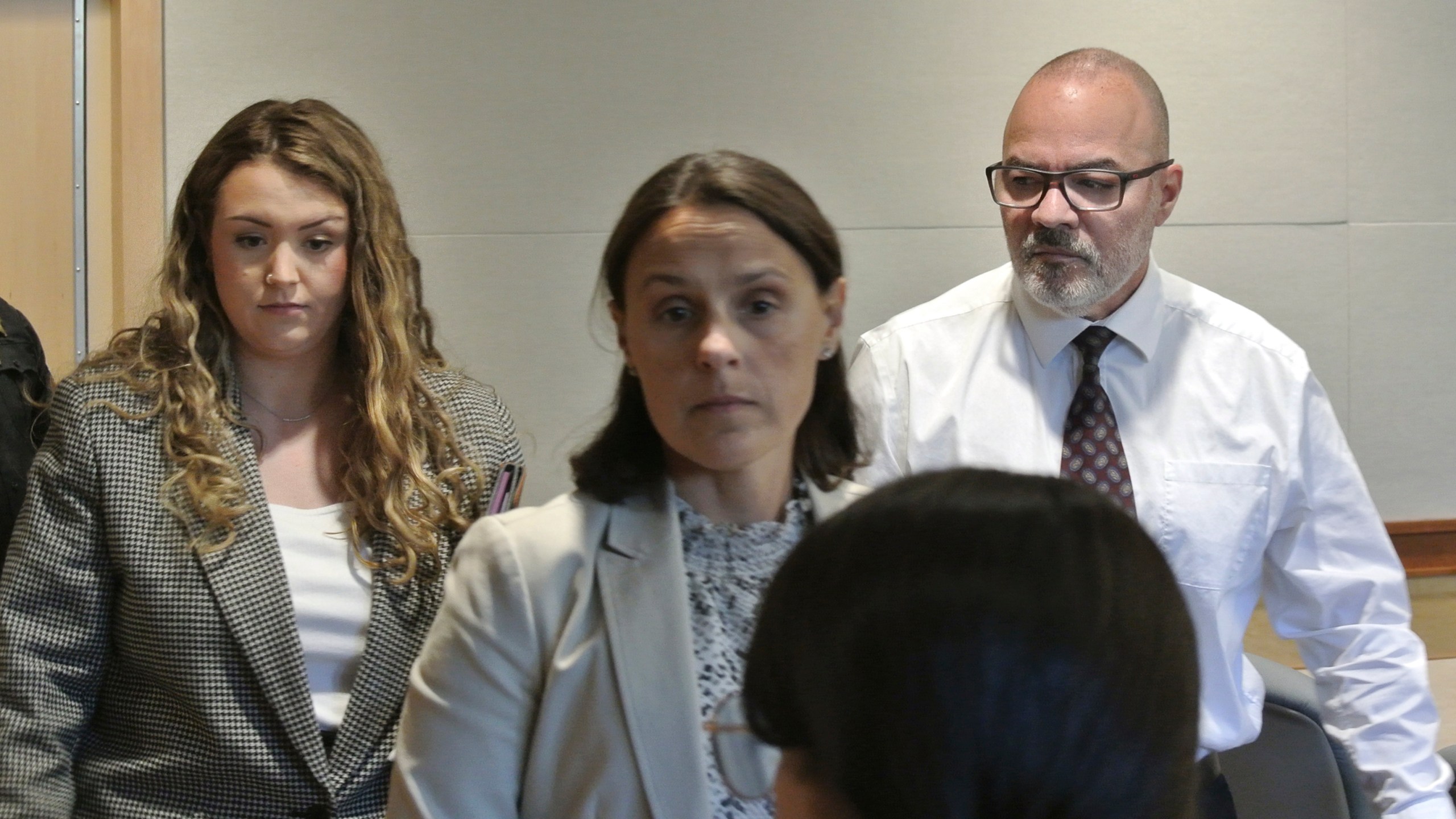 Victor Malavet, right, stands with defense attorneys Zosia Buse, left, and Jaye Duncan, center, as the judge directs the jury to continue with deliberations before later declaring a mistrial, Tuesday, Sept. 3, 2024, at Merrimack County Superior Court, in Concord, N.H. (Damien Fisher/InDepthNH via AP, Pool)