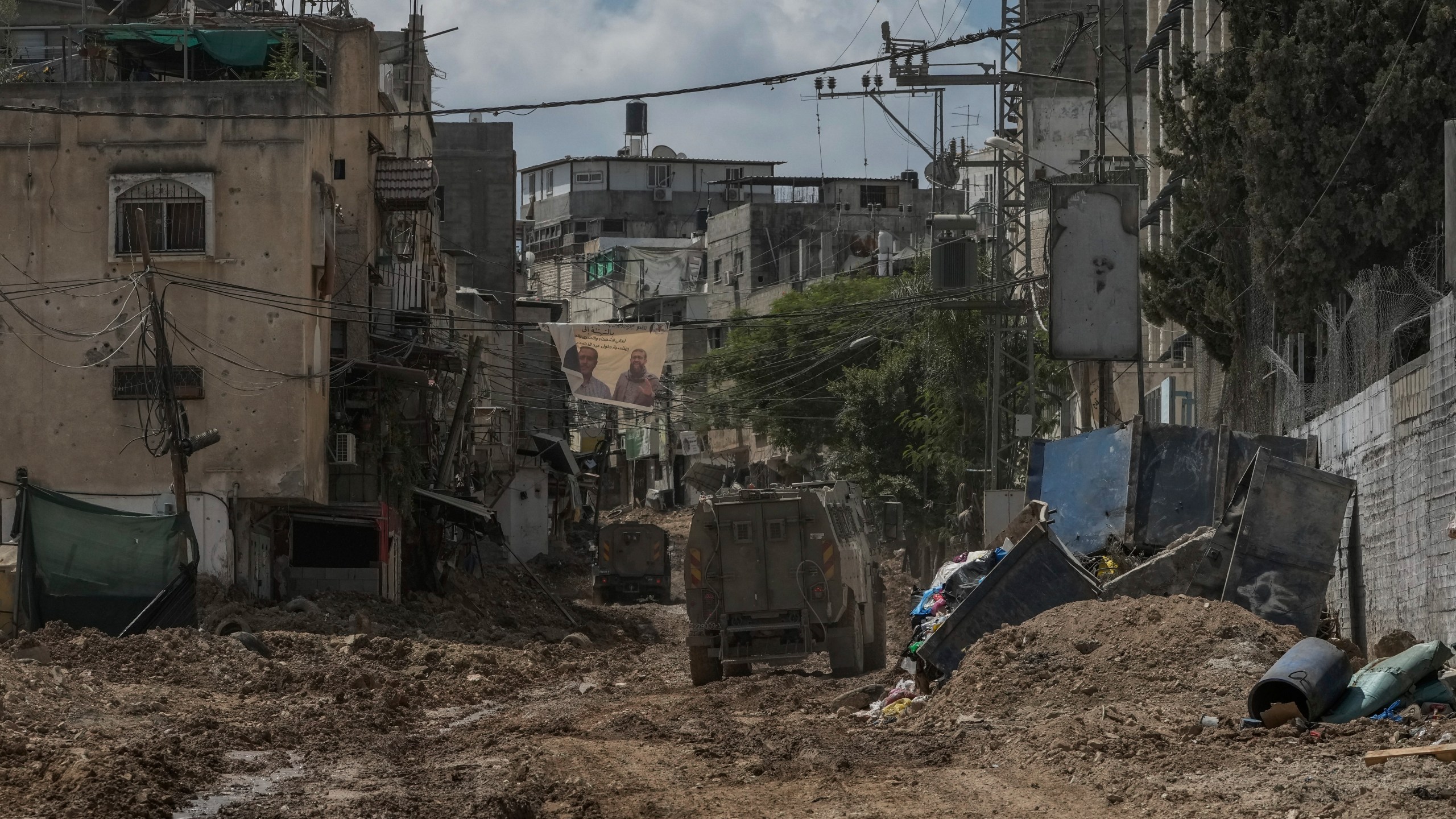 A convoy of Israeli military armored vehicles is seen during an army raid in Tulkarem, West Bank, on Tuesday, Sept. 3, 2024. (AP Photo/Majdi Mohammed)