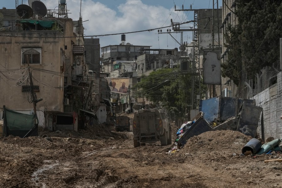 A convoy of Israeli military armored vehicles is seen during an army raid in Tulkarem, West Bank, on Tuesday, Sept. 3, 2024. (AP Photo/Majdi Mohammed)