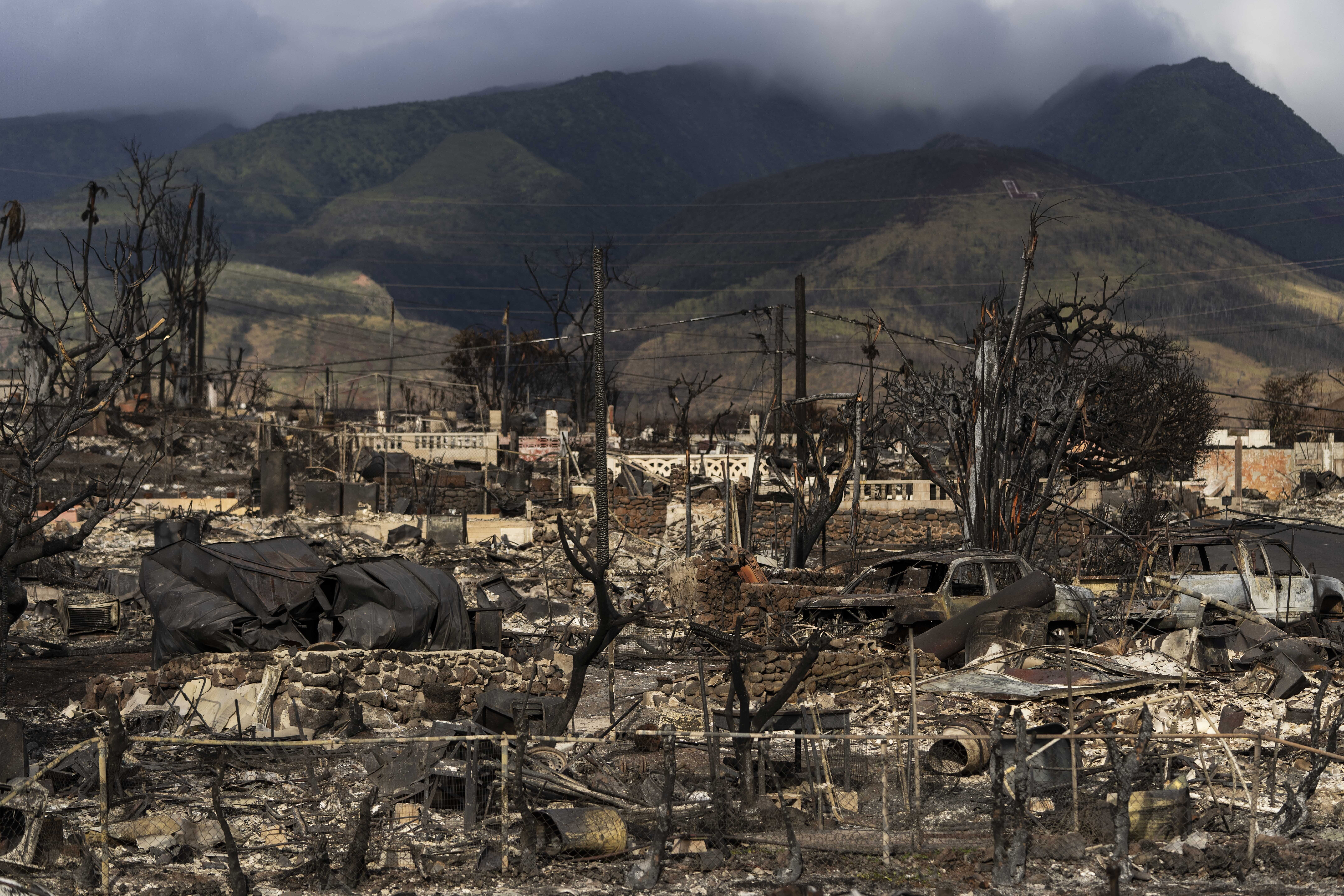 FILE - Damaged property lies scattered in the aftermath of a wildfire in Lahaina, Hawaii, Aug. 21, 2023. (AP Photo/Jae C. Hong, File)