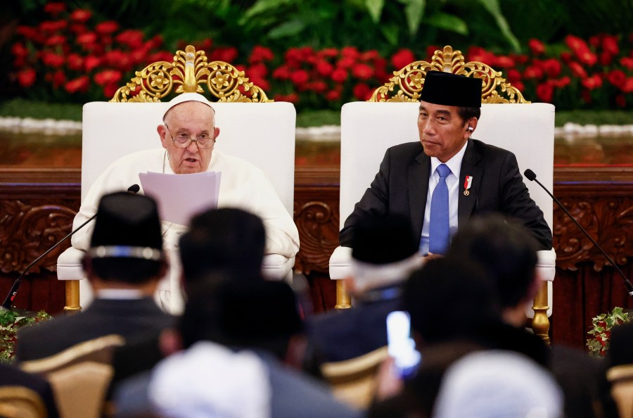 Pope Francis, left, delivers his address as Indonesian President Joko Widodo looks on during a meeting with Indonesian authorities, civil society and the diplomatic corps, during his apostolic visit to Asia, at the Presidential Palace in Jakarta Wednesday, Sept. 4, 2024. (Willy Kurniawan/Pool Photo via AP)