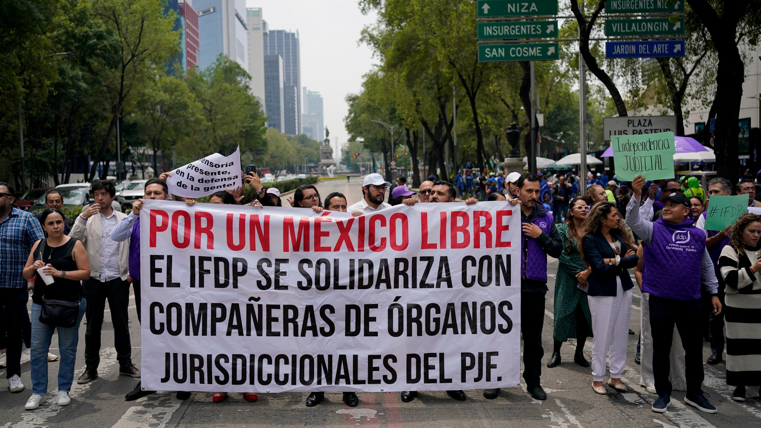 Federal court workers block the road in front of the Senate to protest the government's proposed judicial reform in Mexico City, Wednesday, Sept. 4, 2024. (AP Photo/Felix Marquez)