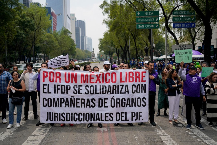 Federal court workers block the road in front of the Senate to protest the government's proposed judicial reform in Mexico City, Wednesday, Sept. 4, 2024. (AP Photo/Felix Marquez)