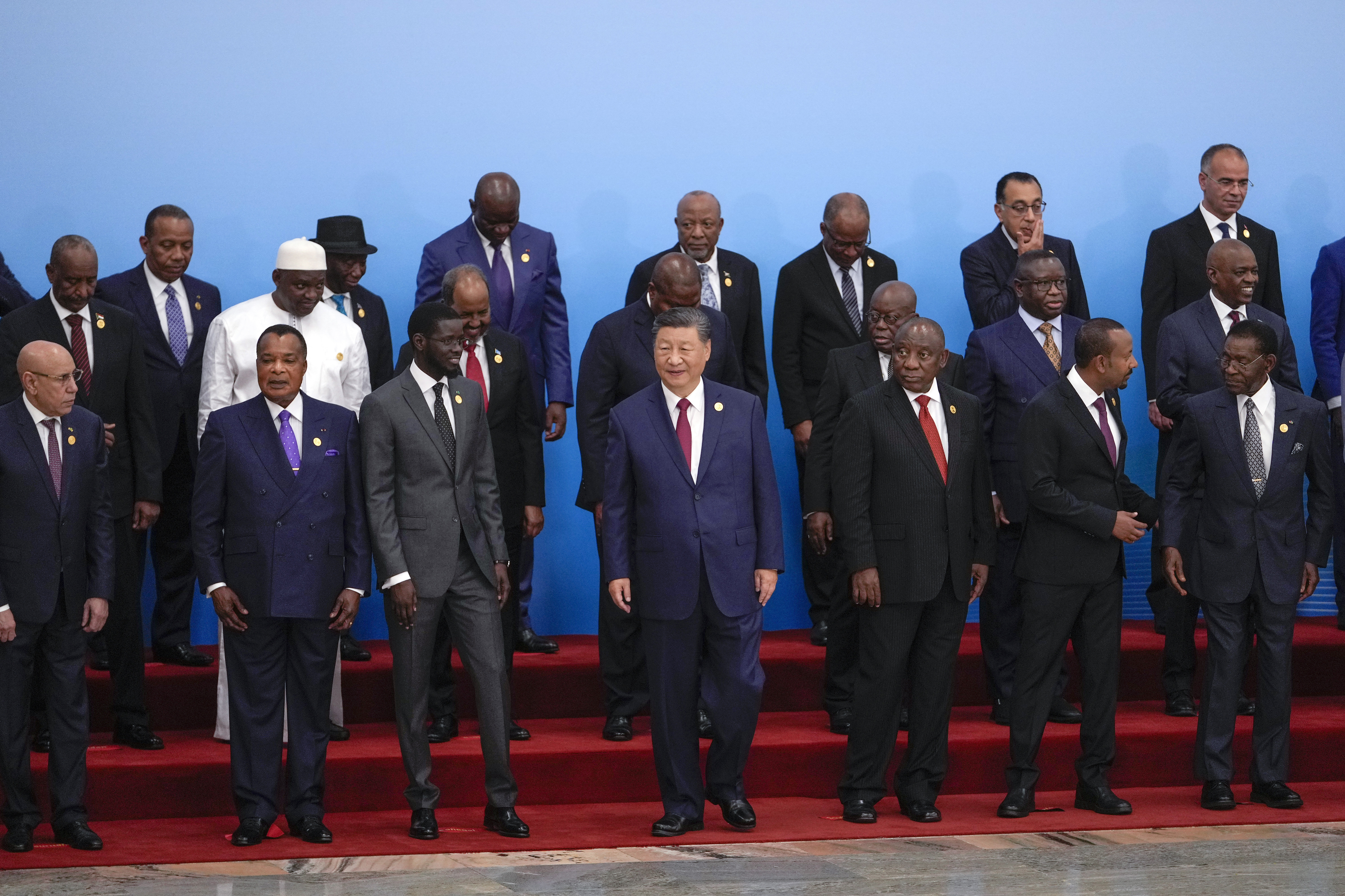 China's President Xi Jinping, center, and leaders from African countries prepare to leave after a group photo session for the opening ceremony of the China Africa Forum at the Great Hall of the People in Beijing, Thursday, Sept. 5, 2024. (AP Photo/Andy Wong, Pool)