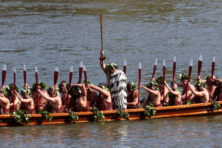 A waka, a traditional canoe, is paddled by warriors as part of the funeral of New Zealand's Maori King, Kiingi Tuheitia Pootatau Te Wherowhero VII, in Ngaruawahia, New Zealand, Thursday, Sept. 5, 2024. (AP Photo/Alan Gibson)