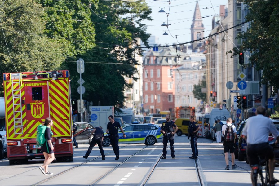 Police officers block a street after police fired shots at a suspicious person near the Israeli Consulate and a museum on the city's Nazi-era history in Munich, Germany, Thursday, Sept. 5, 2024. (AP Photo/Matthias Schrader)