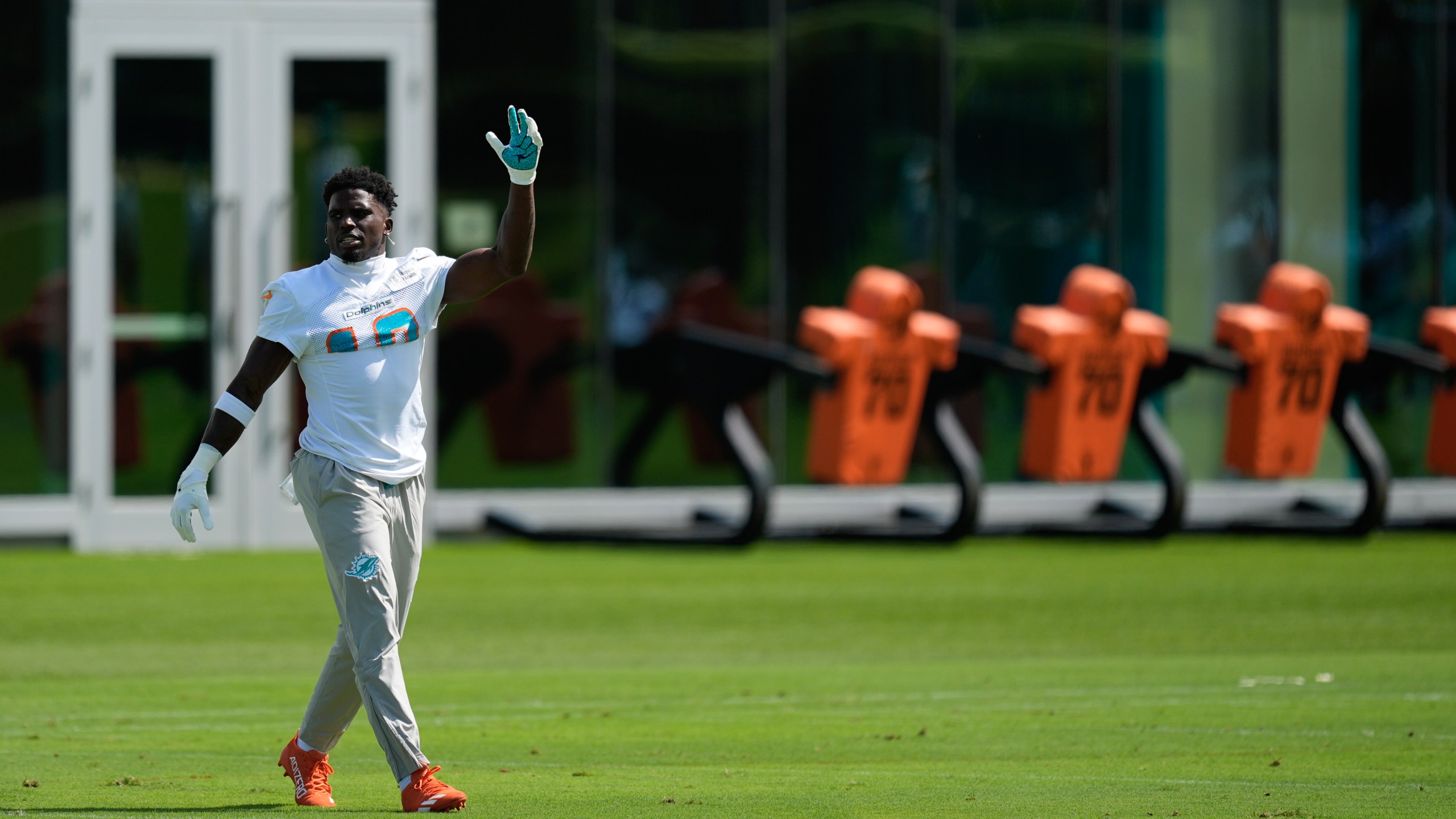 Miami Dolphins wide receiver Tyreek Hill walks on the field during a team practice session, Wednesday, Sept. 11, 2024, in Miami Gardens, Fla.(AP Photo/Rebecca Blackwell)